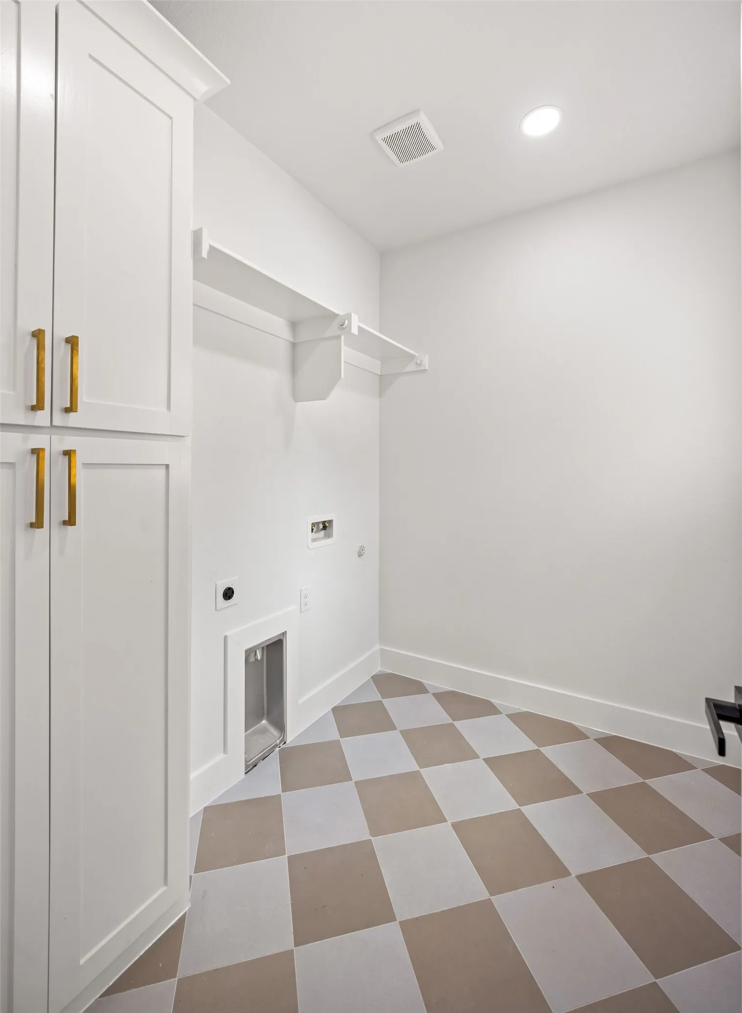 Utility room featuring white cabinetry with gold-finish hardware, open shelving, recessed lighting, and a checkerboard pattern floor