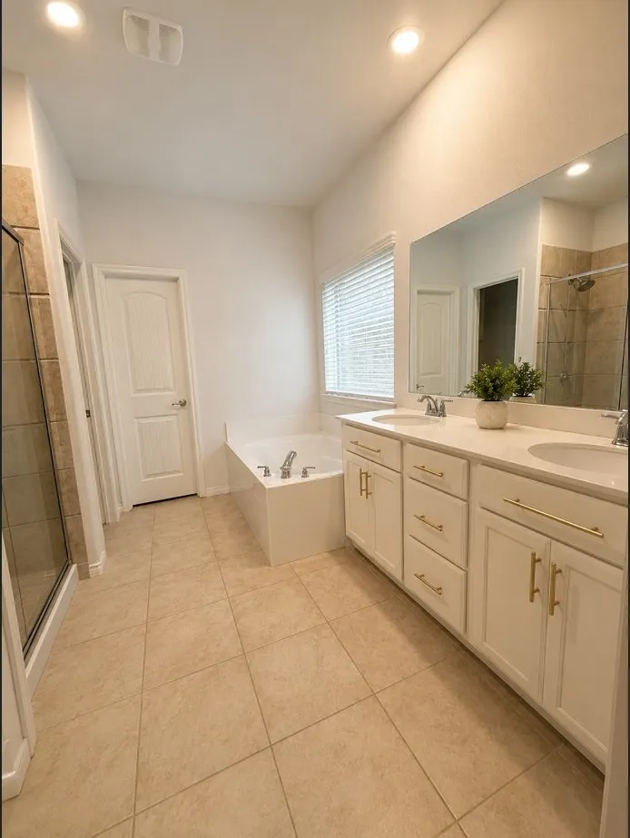 Master ensuite bath is big with 2 vanities, separate shower and tub