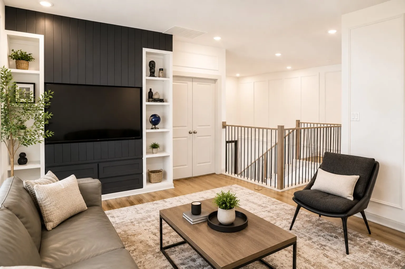 Integrated media wall featuring vertical paneling and built-in shelving