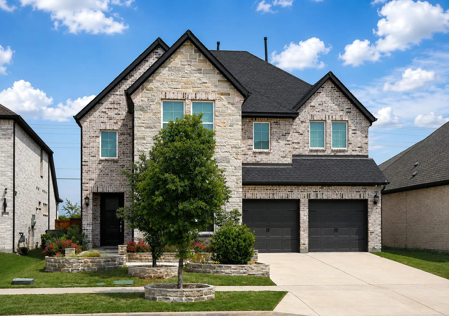 Contemporary two-story residence featuring a light-colored brick exterior with dark trim and a dark shingle roof