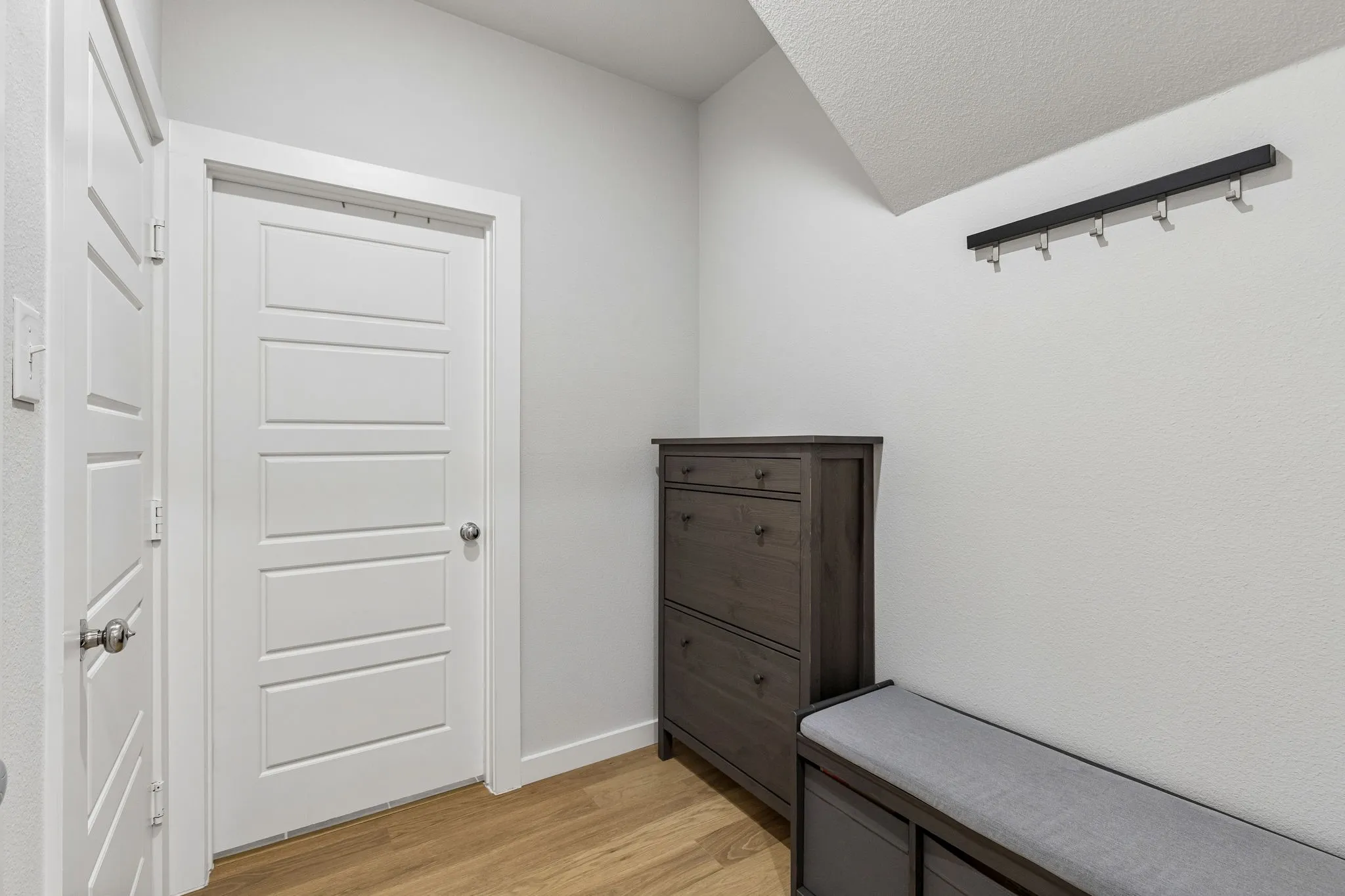 Garage entry on left; Facing door leading to laundry room