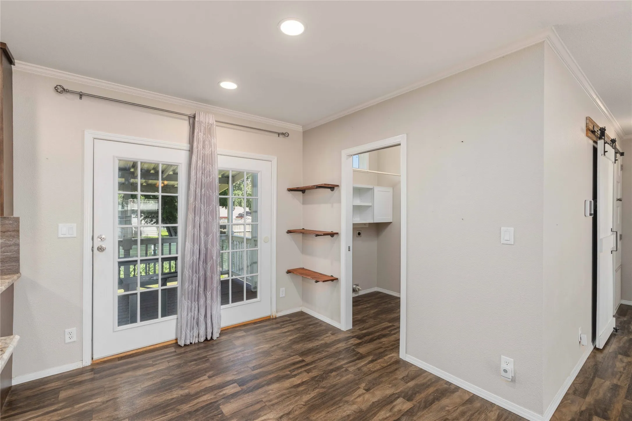 leads to the laundry room, and to the back covered deck