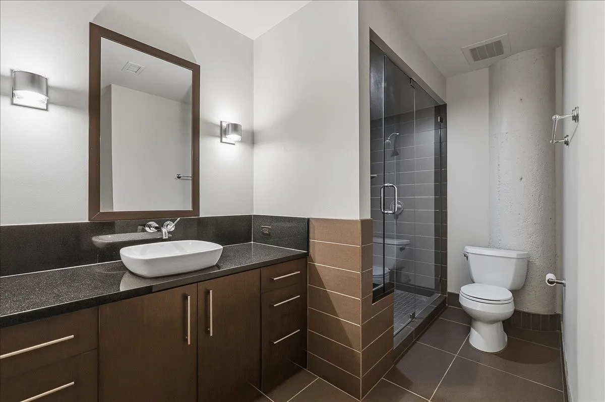 Hallway access so guests do not have to enter bedroom to get to bath.