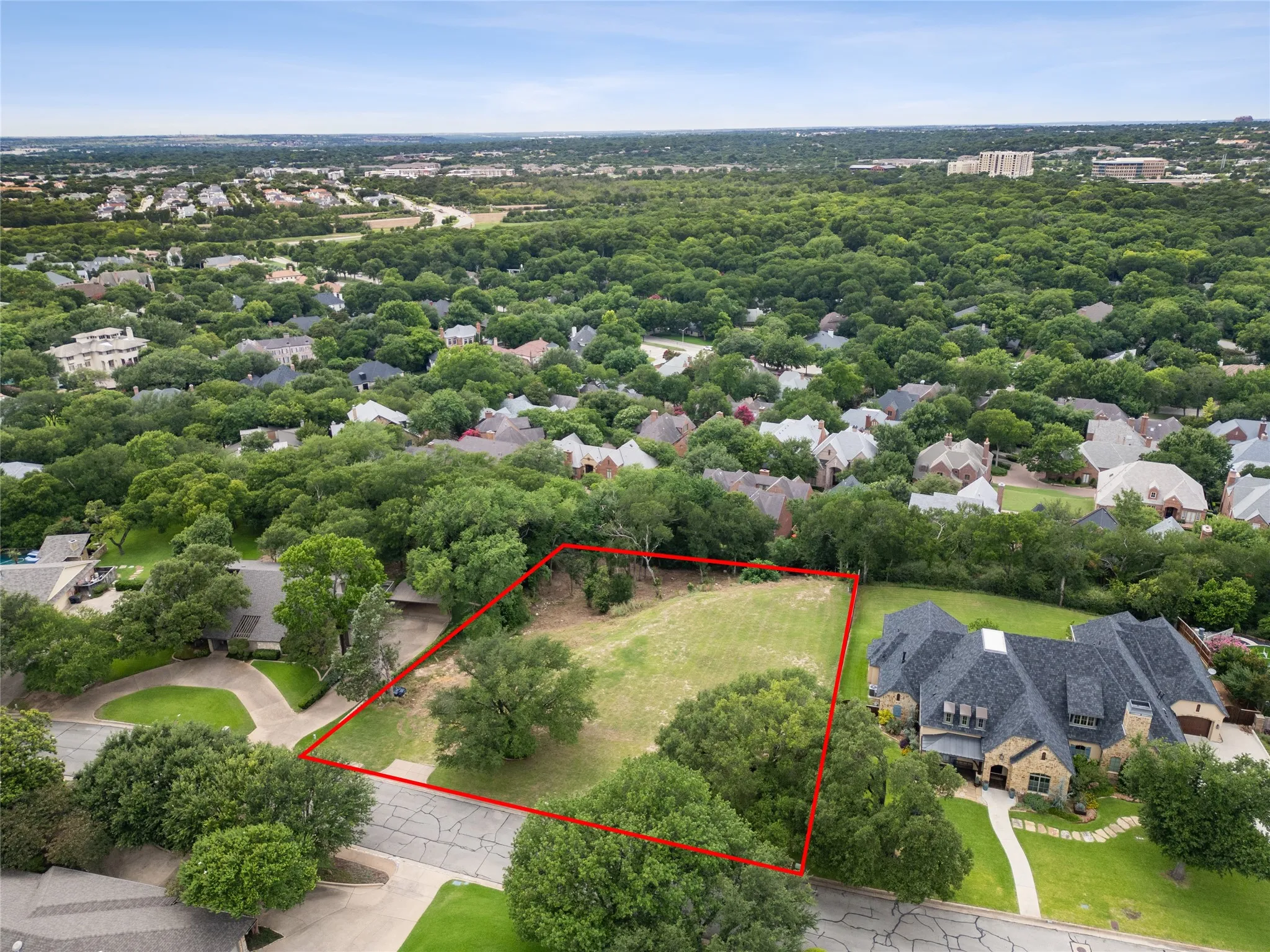 Approximate boundary lines shown for reference only; aerial view highlights the lot’s scale, open build area, and rare Overton West setting.