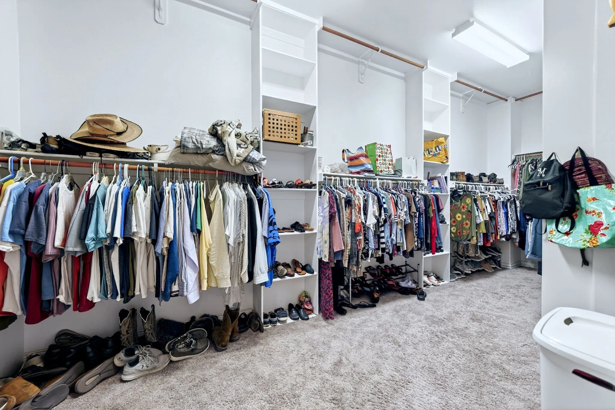 MASSIVE . . .  Primary closet with functional custom built ins, two large full length mirrors, build in ironing board and more.  A true DREAM SPACE.