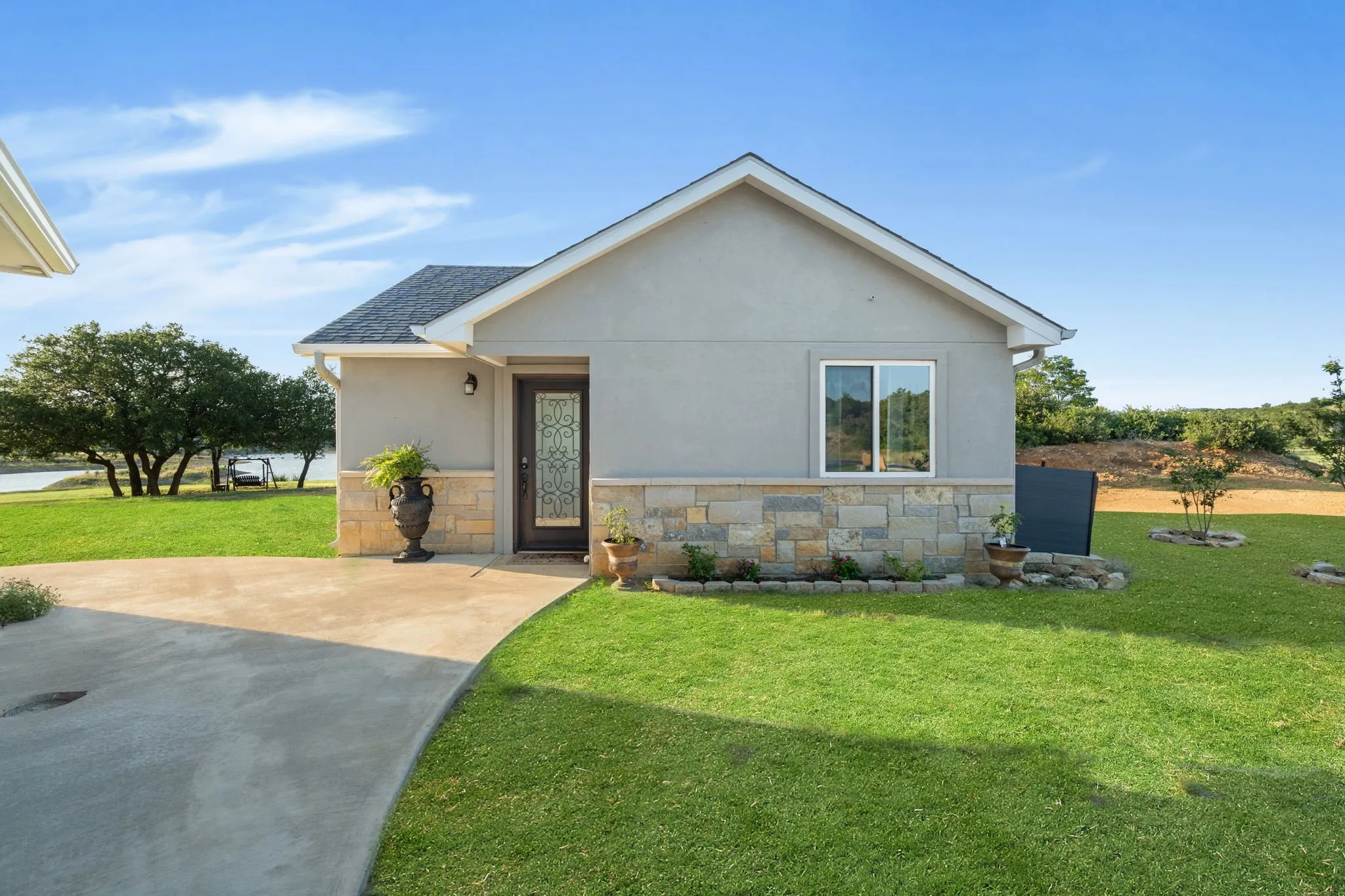 Guest House with Living, Eat-In Kitchen, Two Bedrooms, Full Bath with Laundry Space.