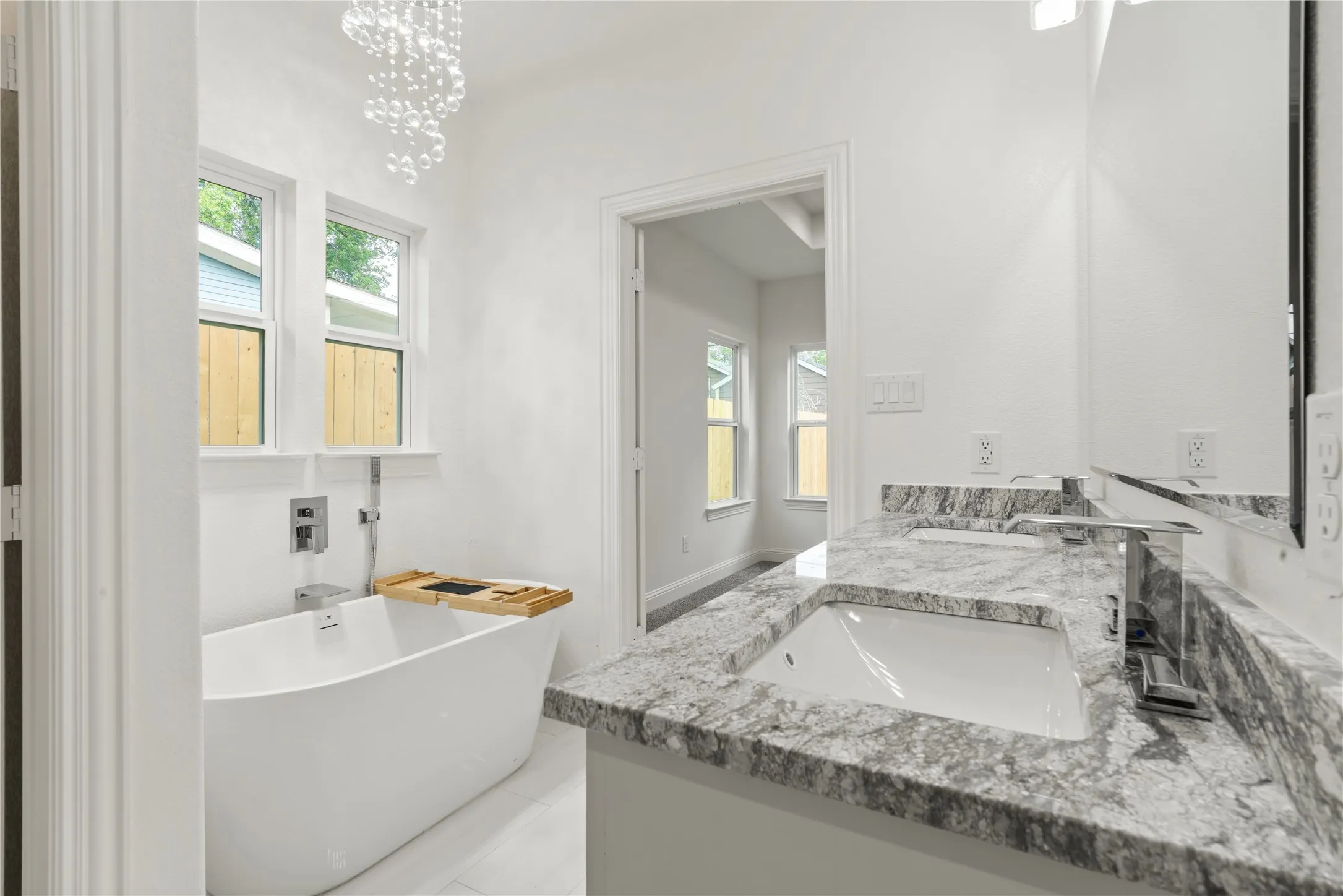 Dual vanity with granite countertops and integrated sinks