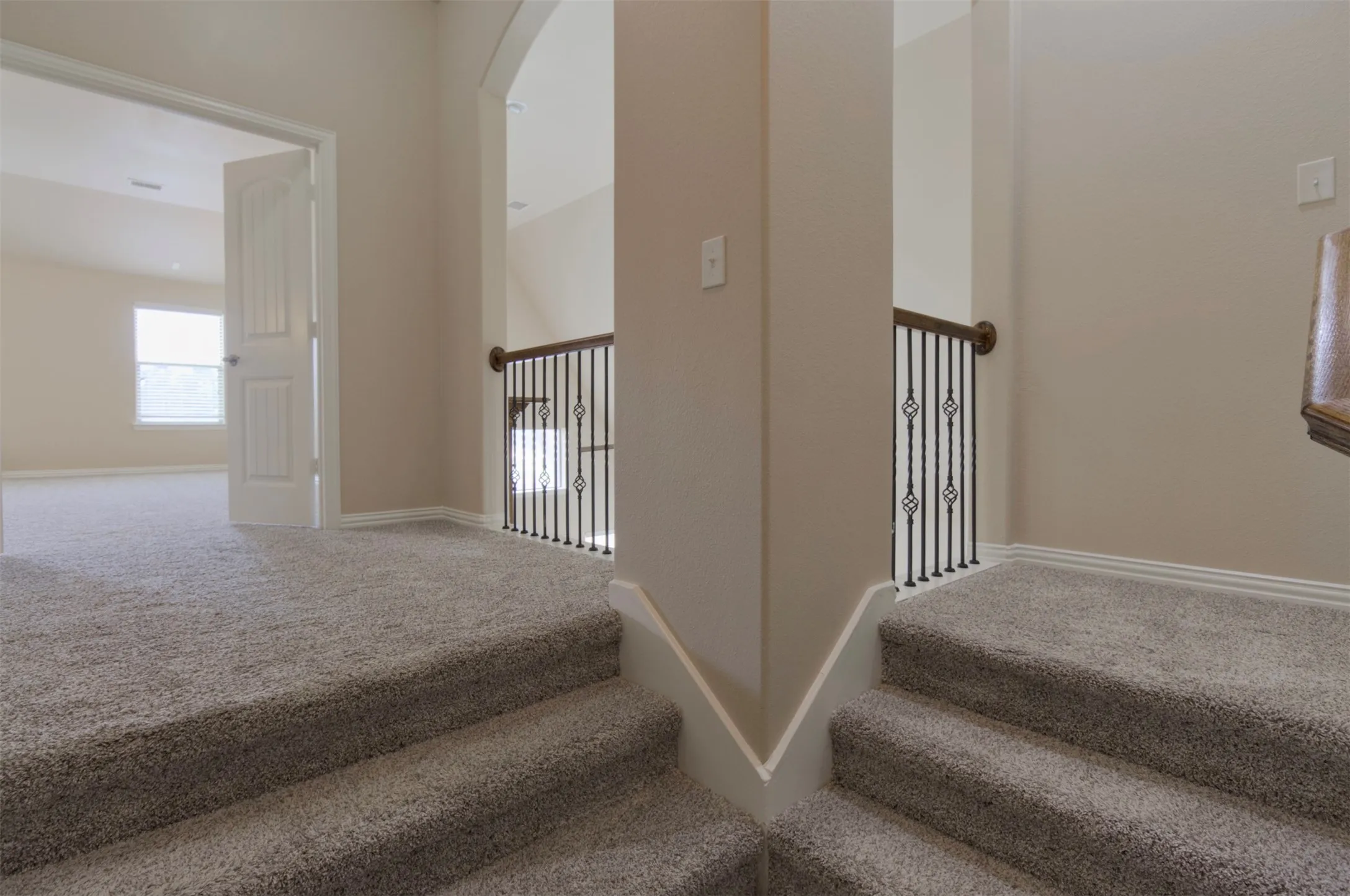 Landing upstairs with media room and 4th bedroom