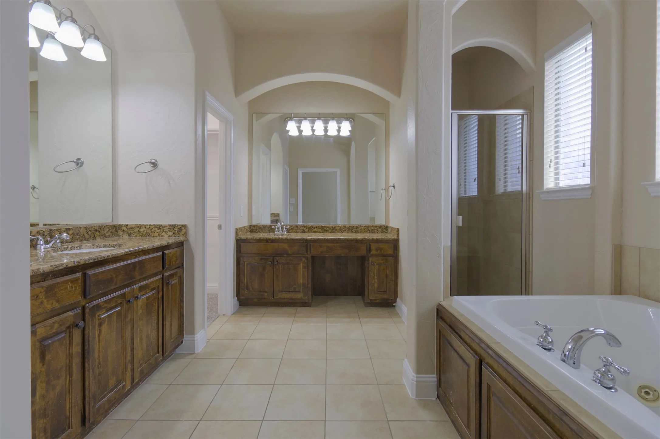 Primary Bathroom with a jetted tub