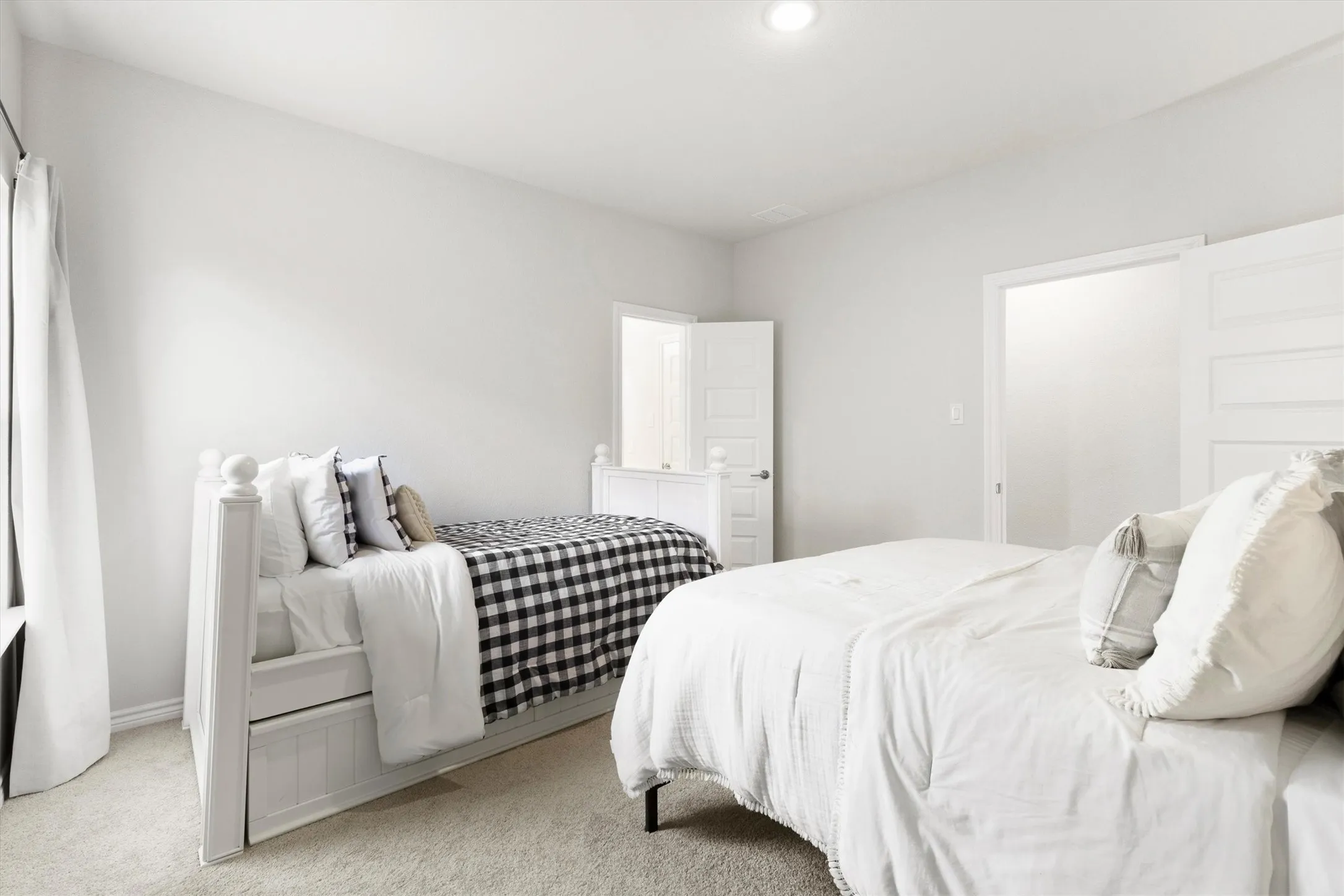 Bright room featuring recessed lighting and neutral-toned walls