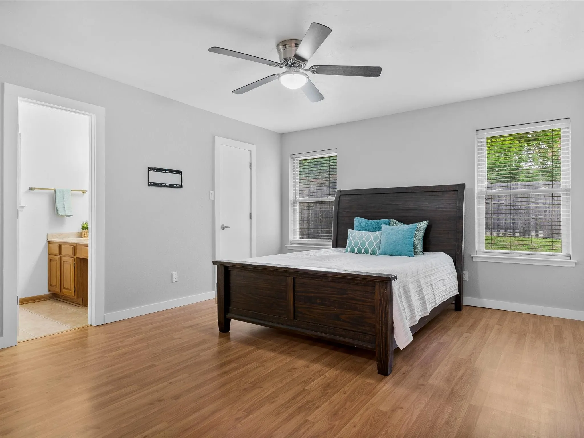 Primary bedroom offering room for large furnishings and personal retreat space.