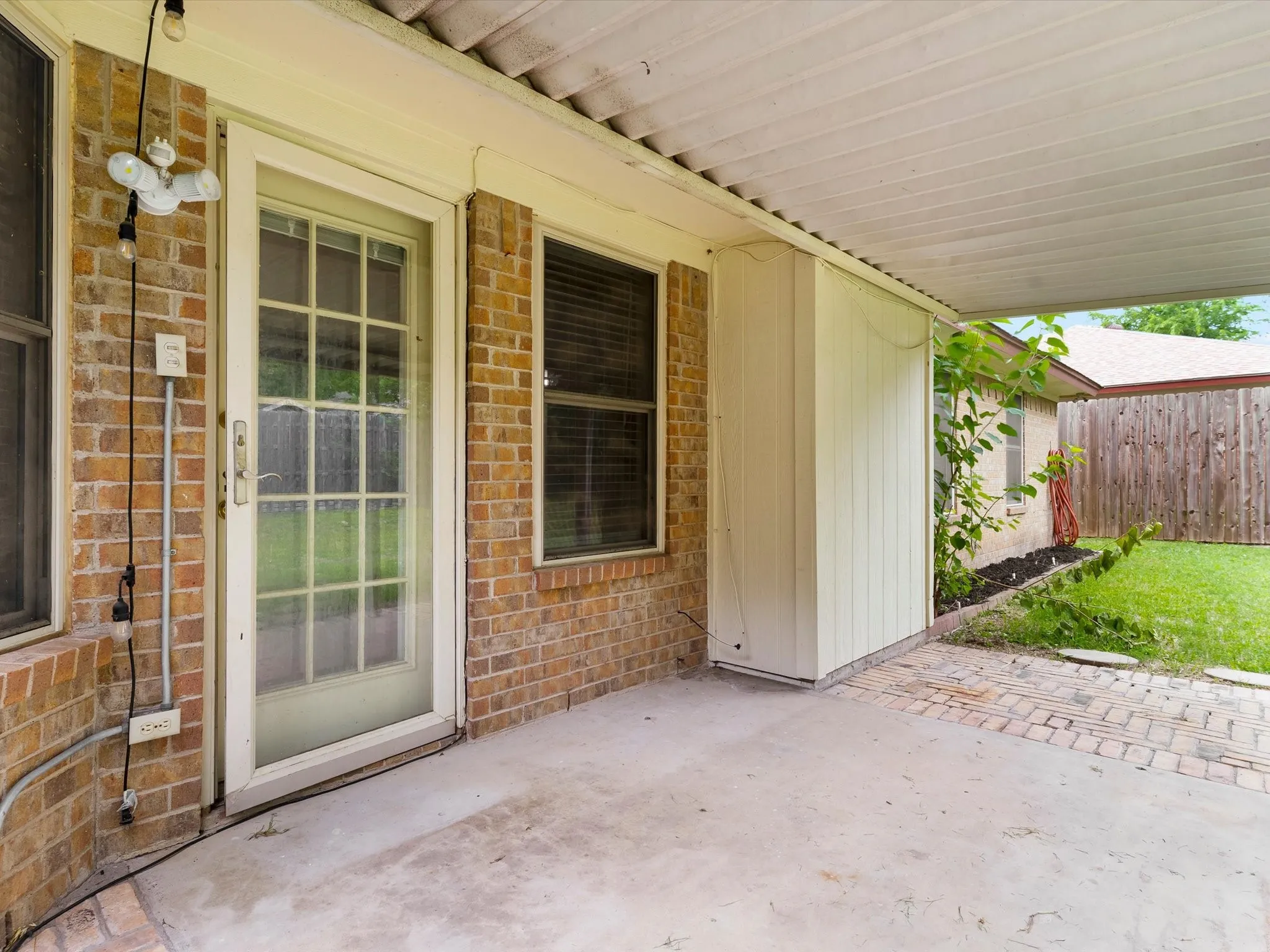 Covered patio providing outdoor seating and entertaining opportunities