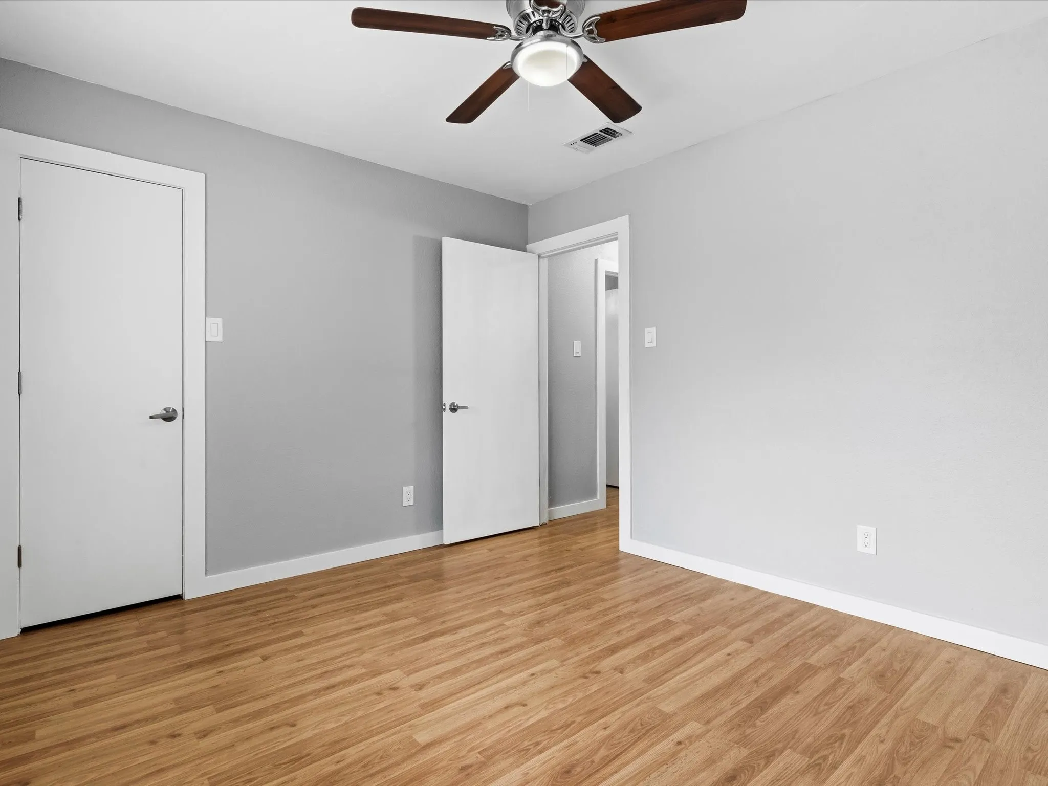 Secondary bedroom with closet storage and versatile use options.