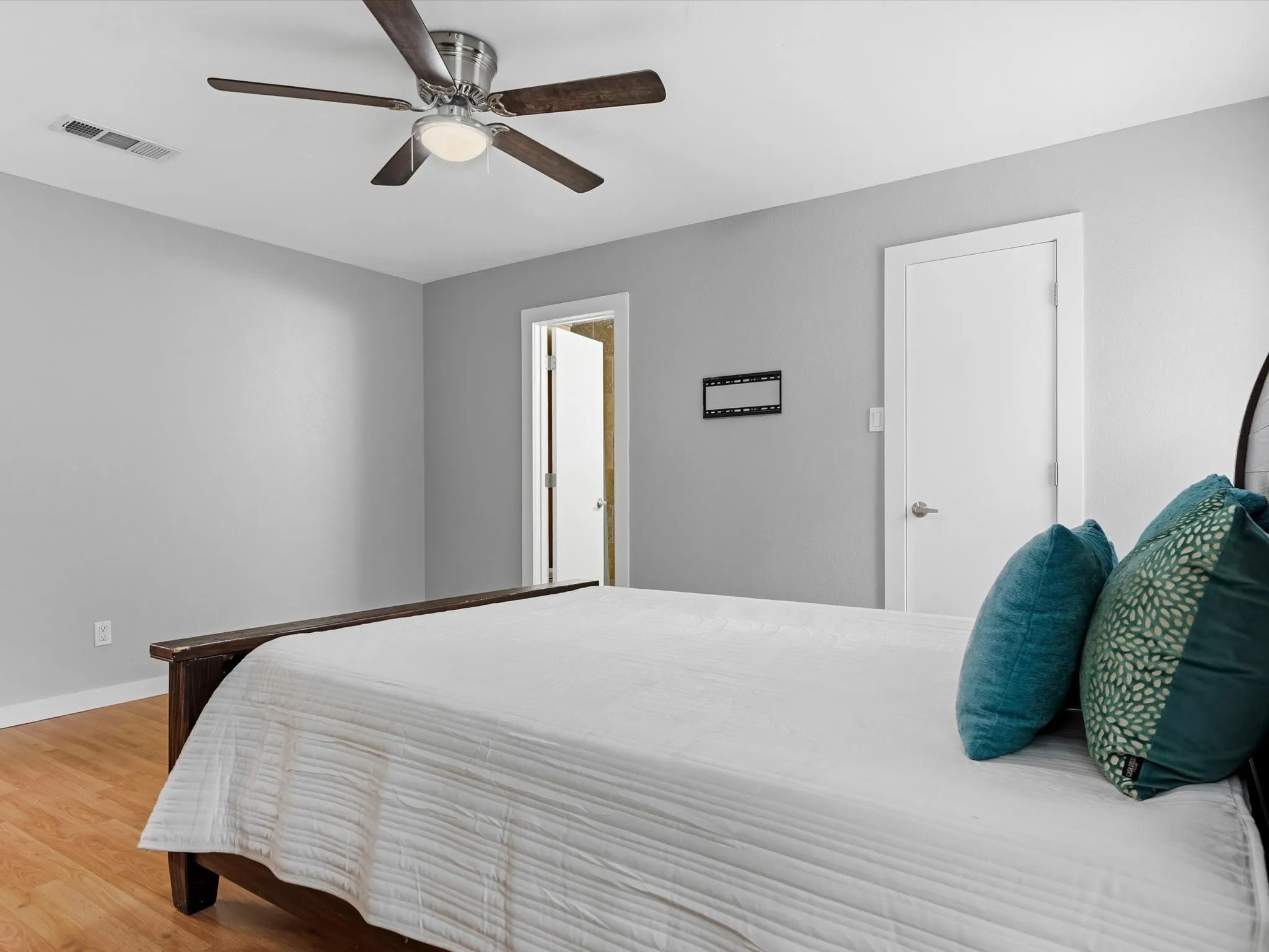 Primary bedroom offering room for large furnishings and personal retreat space.