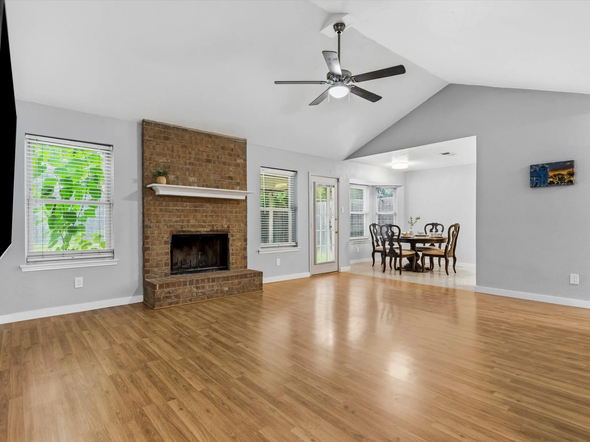 Living area offering flexible furniture placement and seamless flow to the dining space.