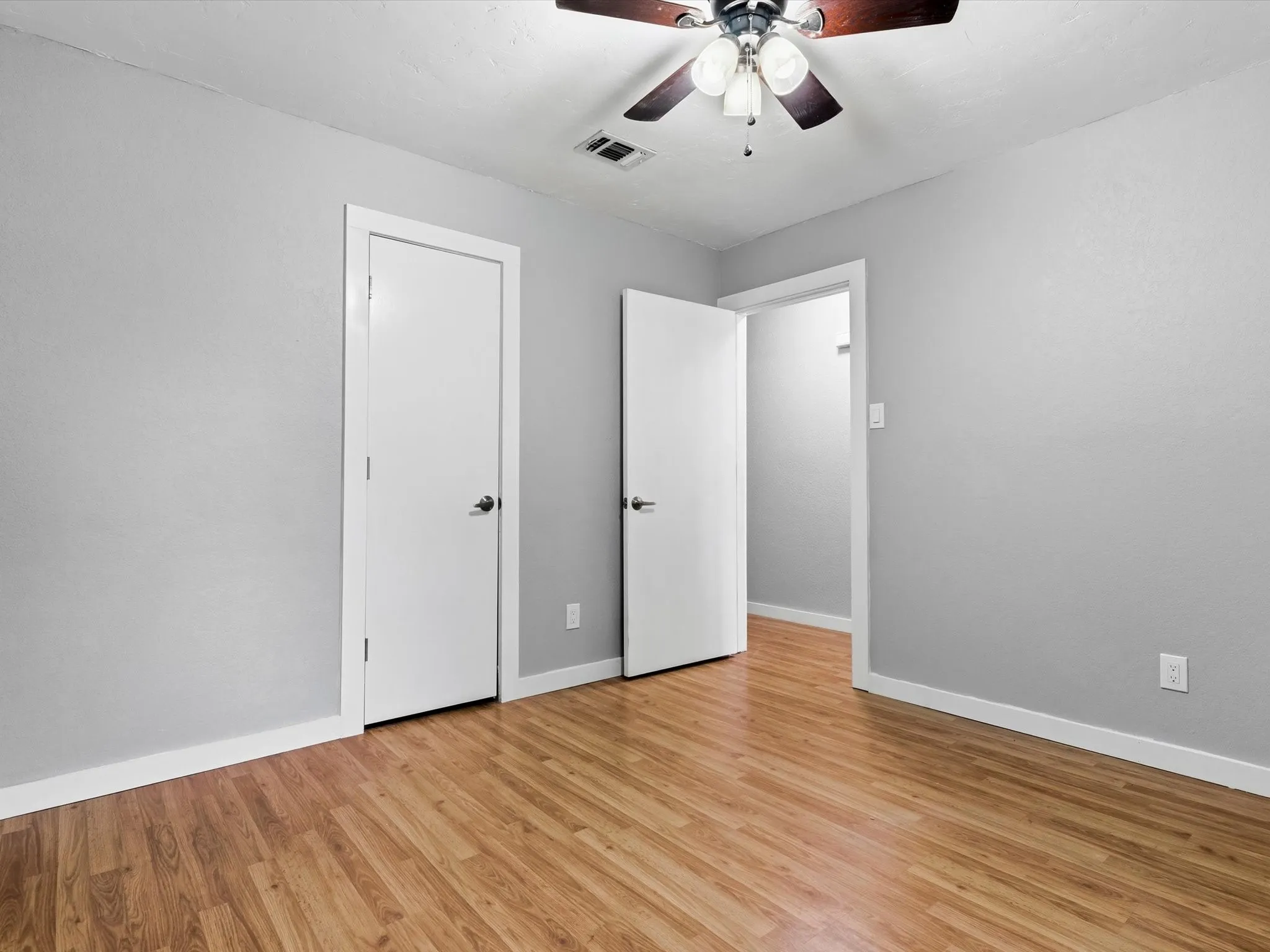 Secondary bedroom with closet storage and versatile use options.