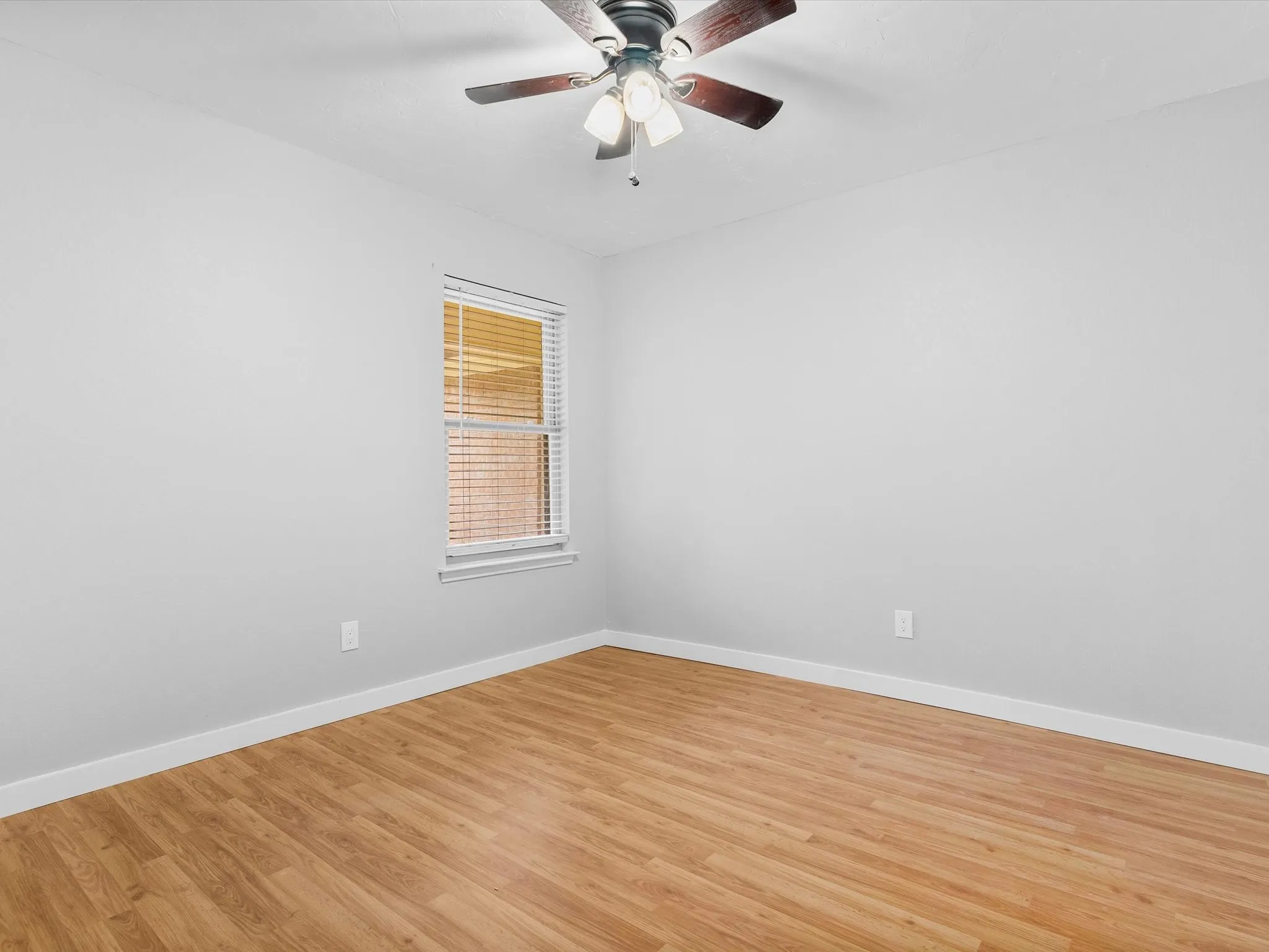 Secondary bedroom with closet storage and versatile use options.