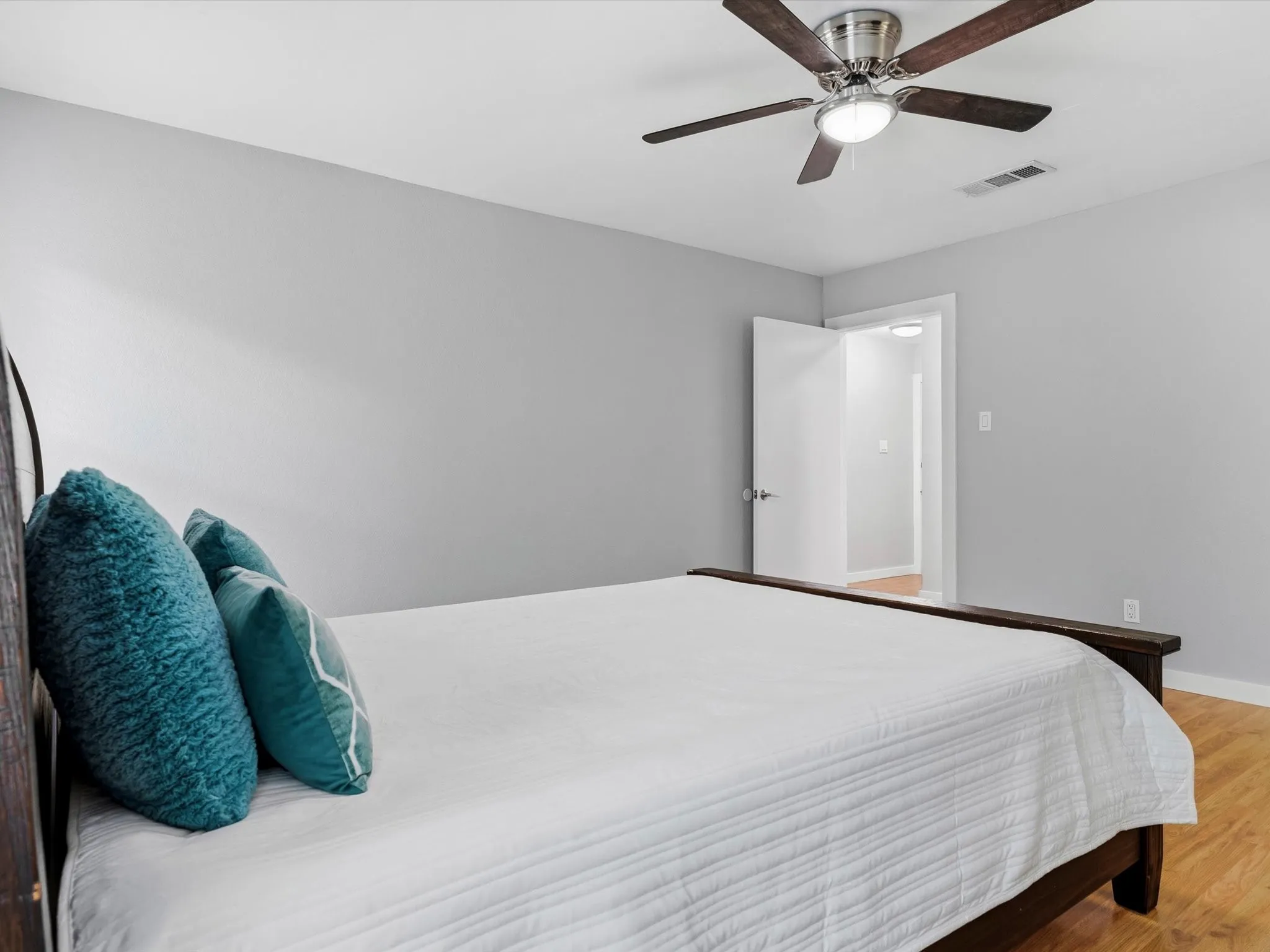 Primary bedroom offering room for large furnishings and personal retreat space.