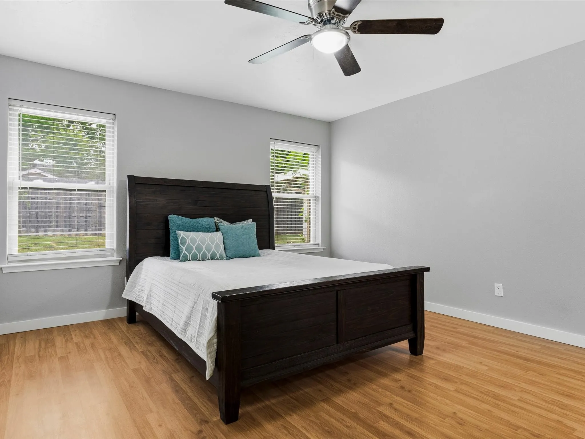 Primary bedroom offering room for large furnishings and personal retreat space.