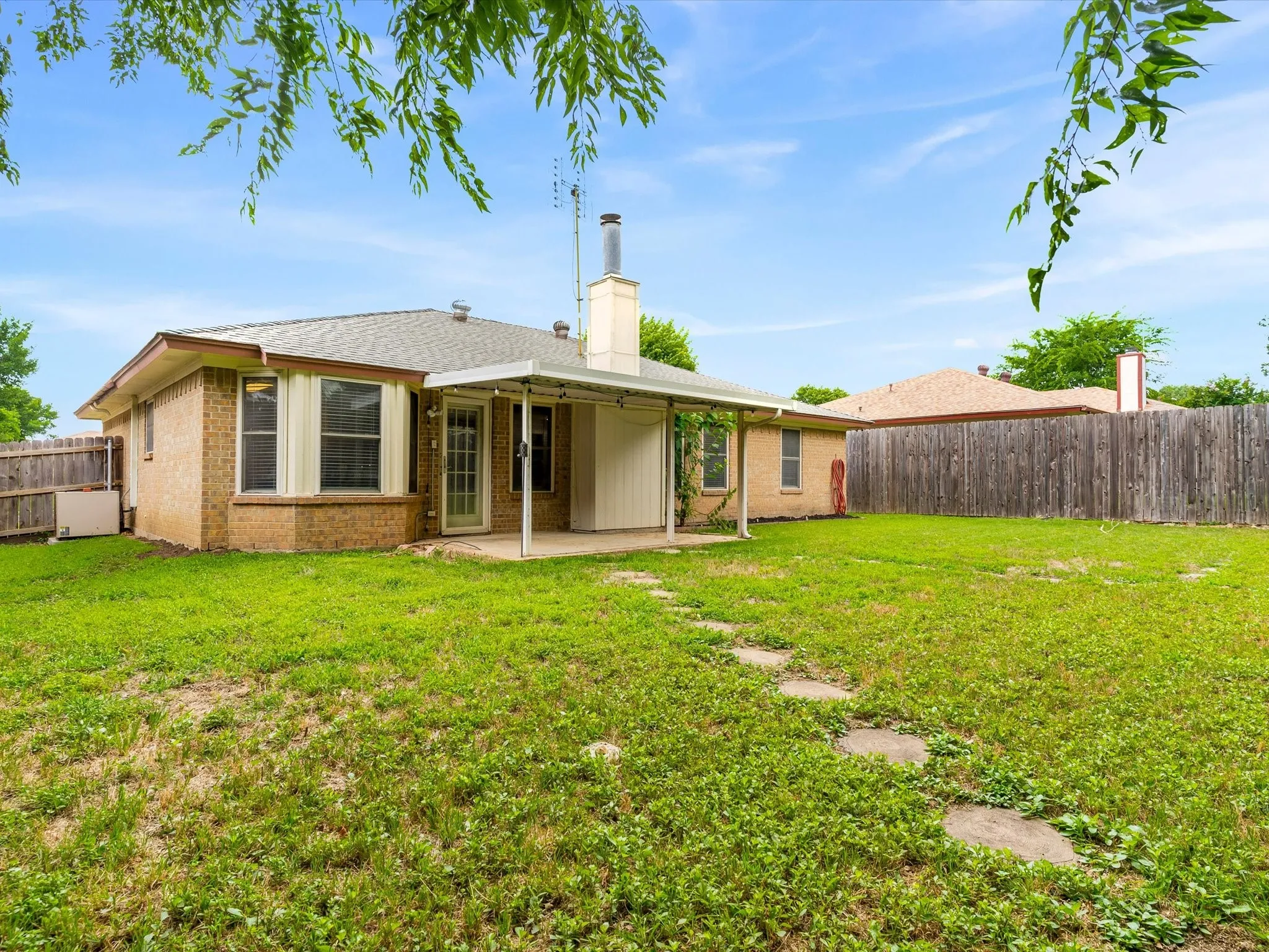 Fully fenced backyard offering privacy and outdoor enjoyment.