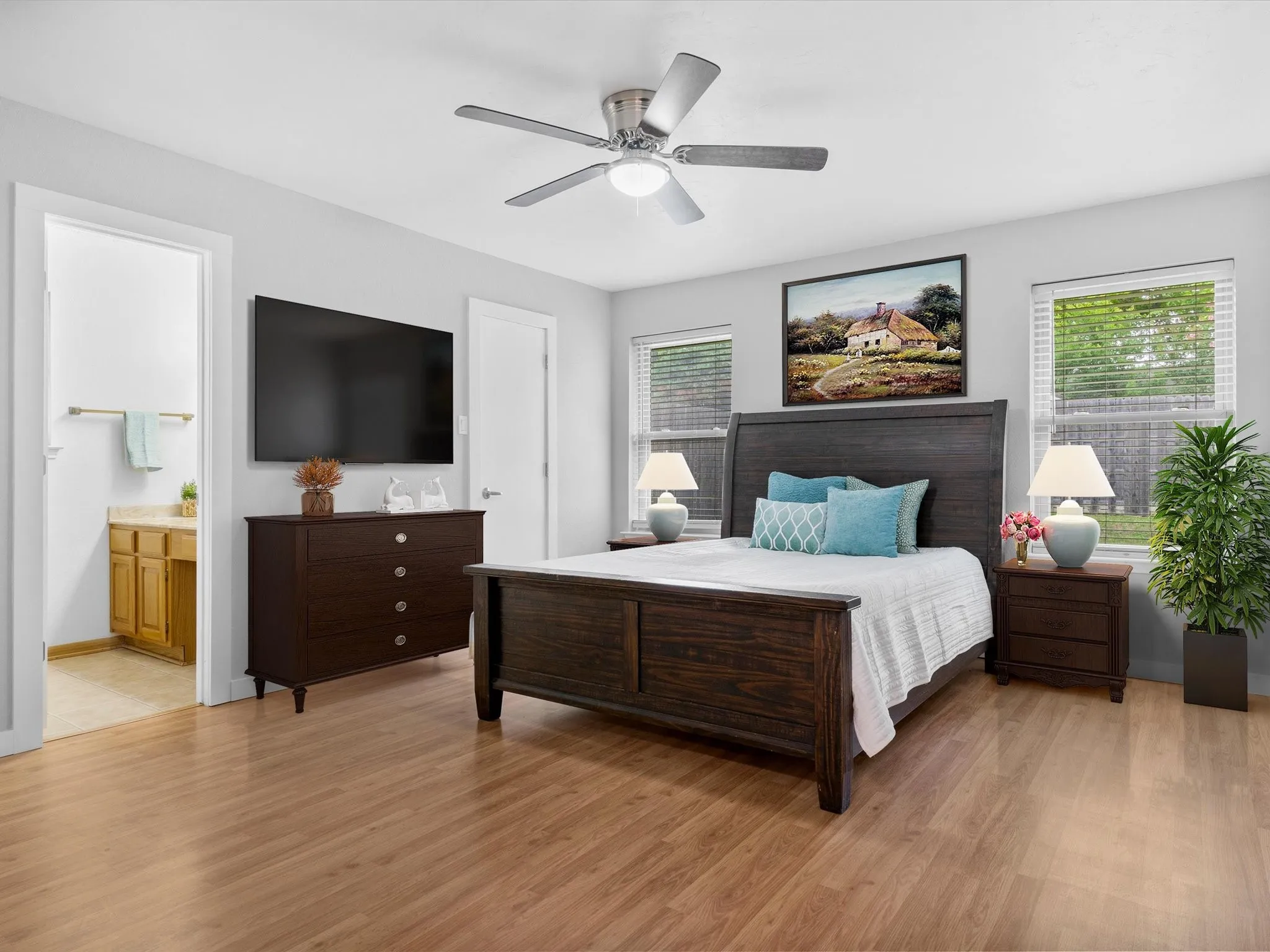 Primary bedroom offering room for large furnishings and personal retreat space. Contains some elements of virtual staging