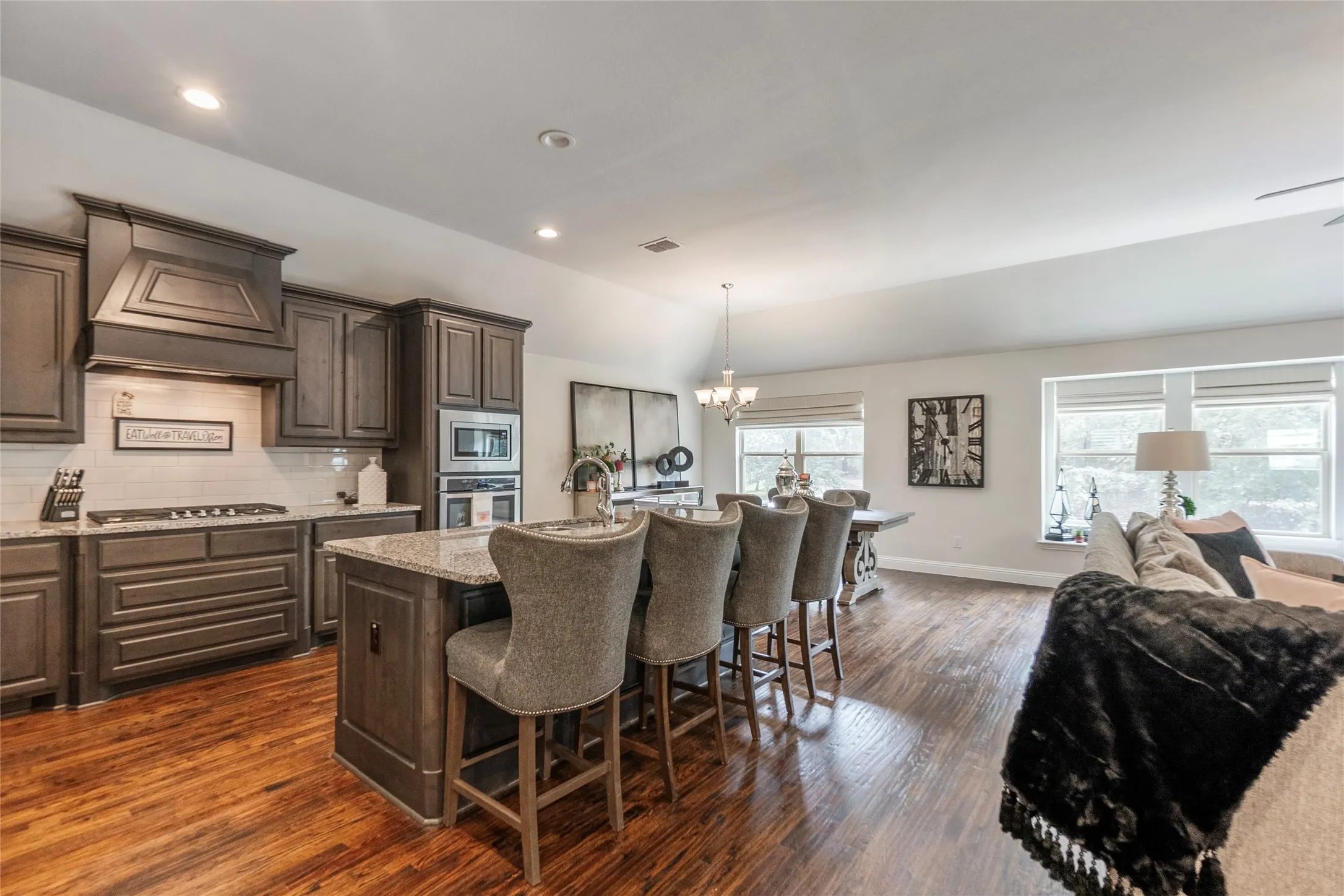 Open floorplan with gourmet kitchen, dining and living room UP