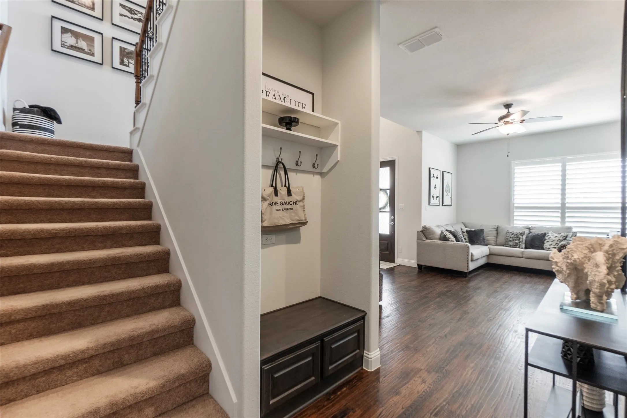 Back staircase to garage entry door and lower living area