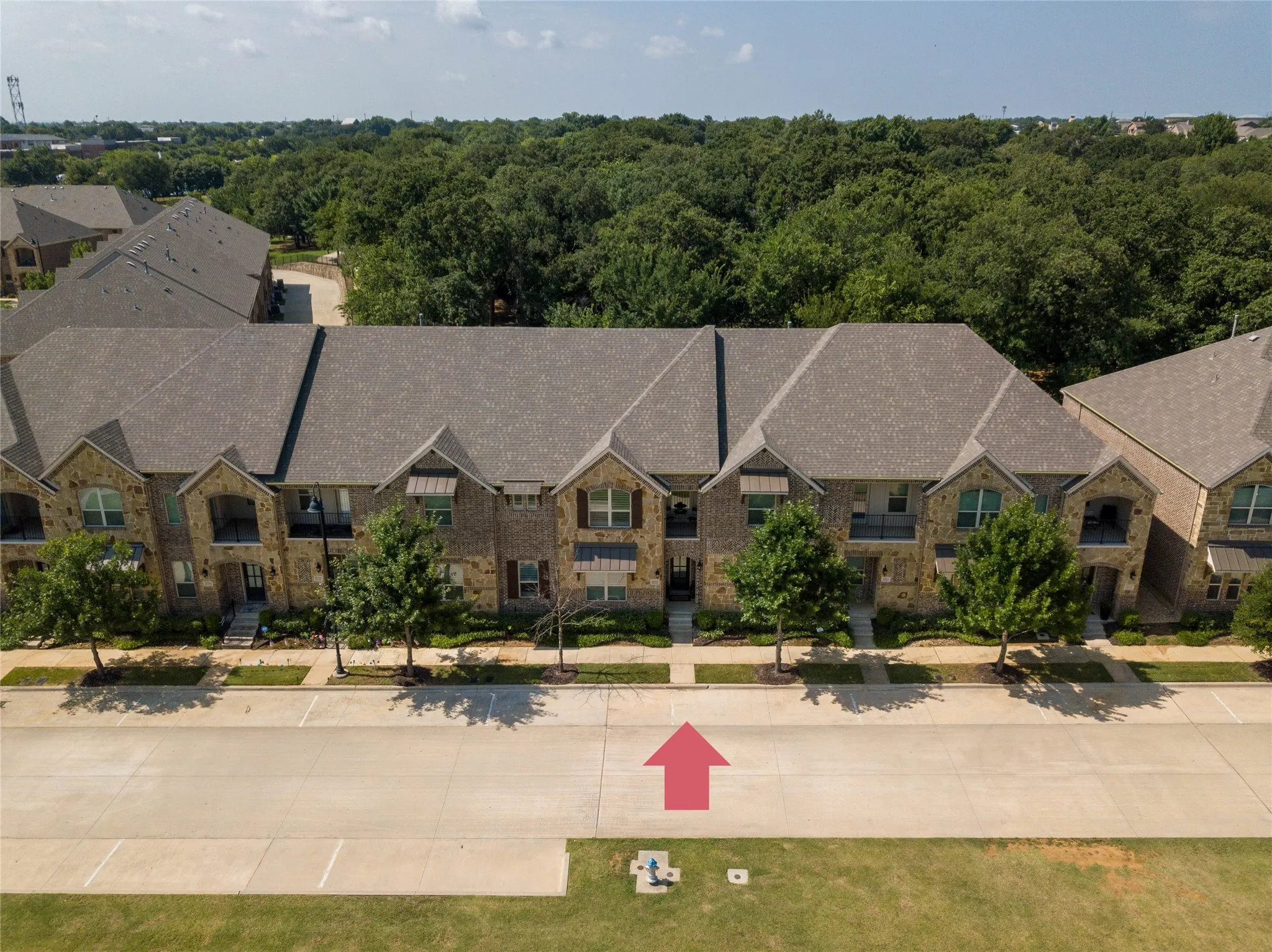 Look at all the trees in the back of this townhome; Rare view in The Riverwalk