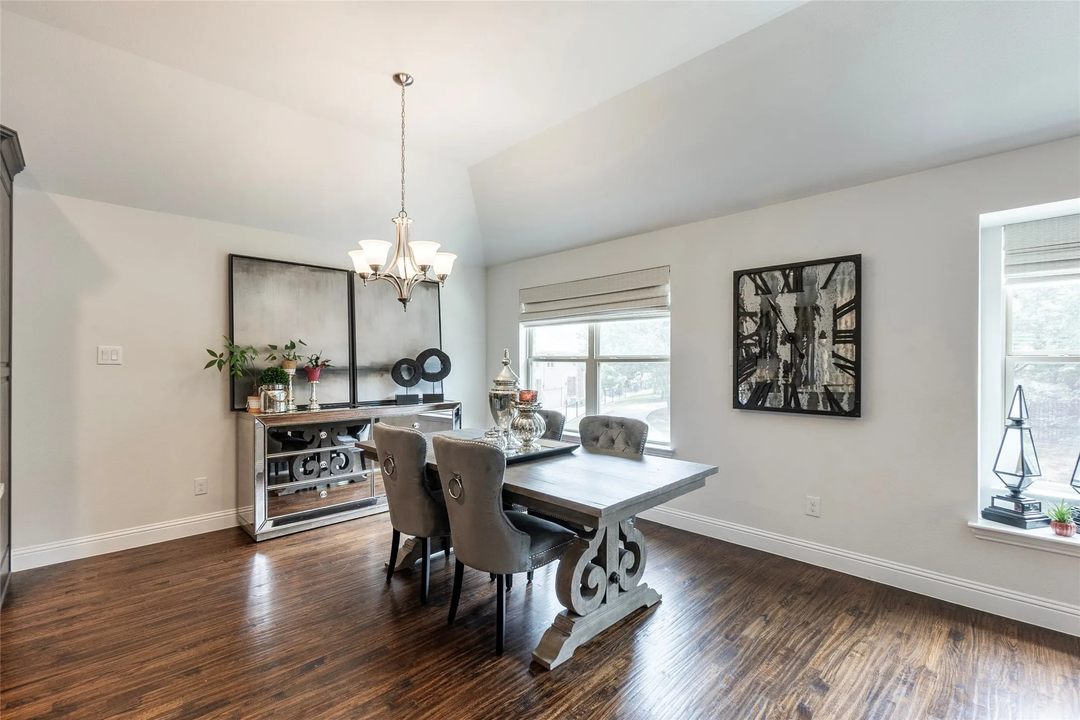 Dining area with room for 6-8 chair dining set and buffet with view of the trees