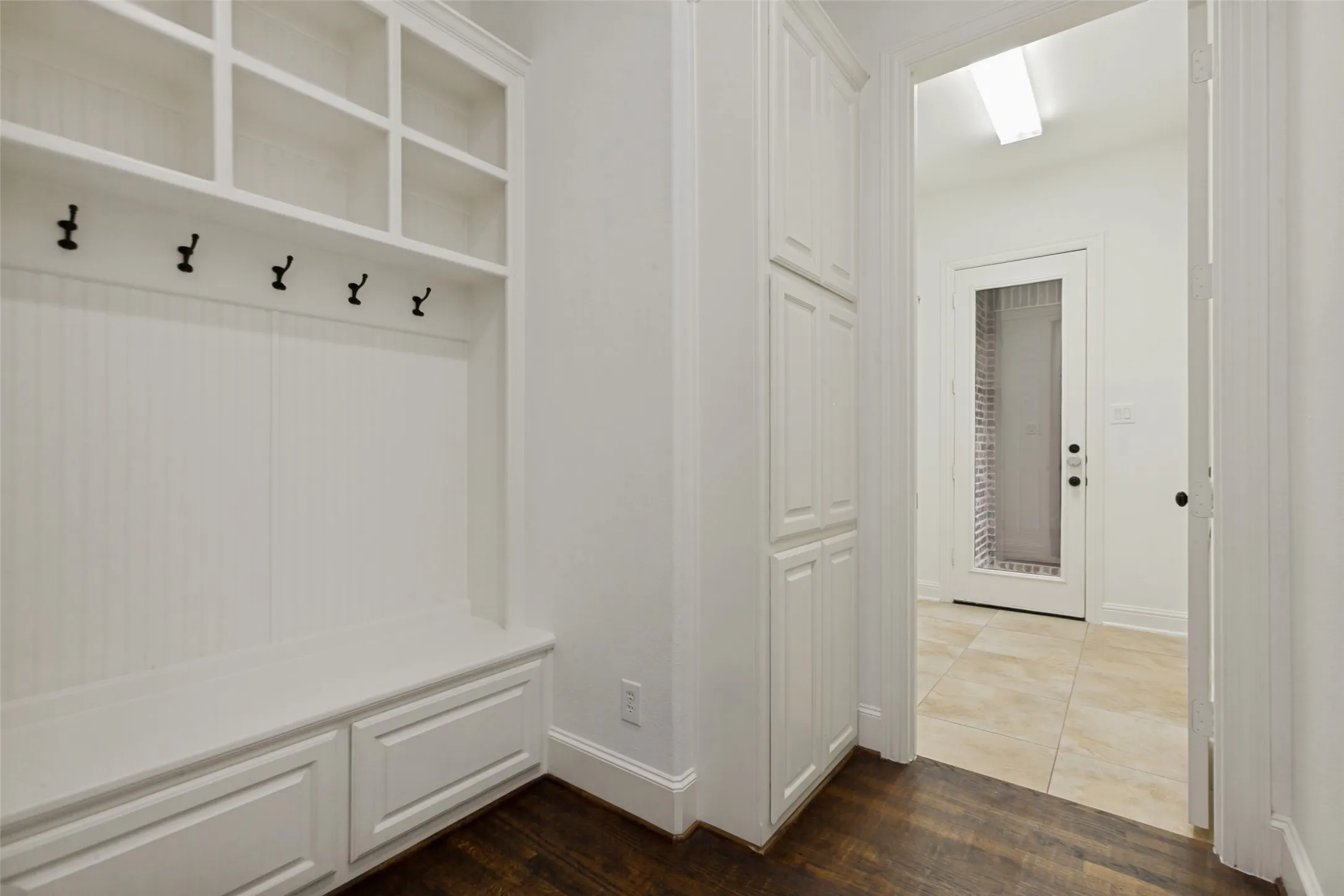 Conveniently located in back hallway near garages