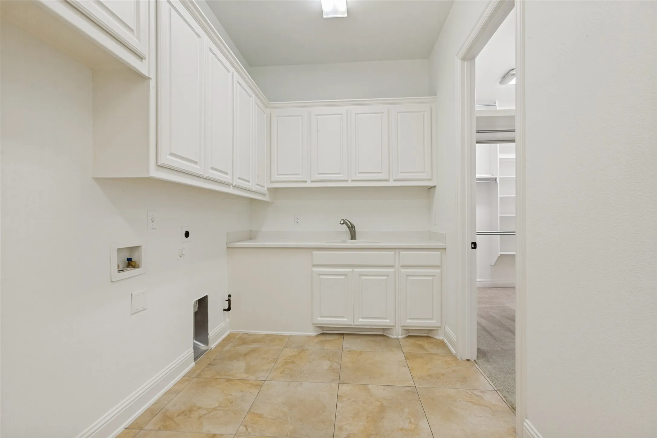 Large laundry room with closet access
