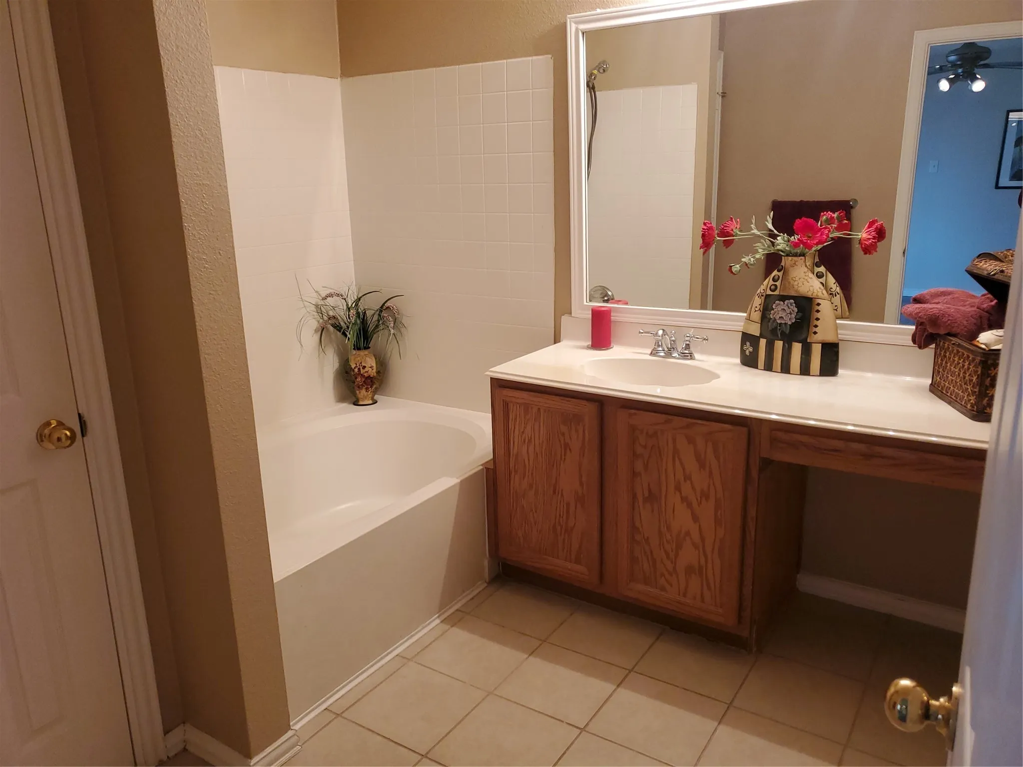 Primary bath has tiled floor, garden tub and linen closet.