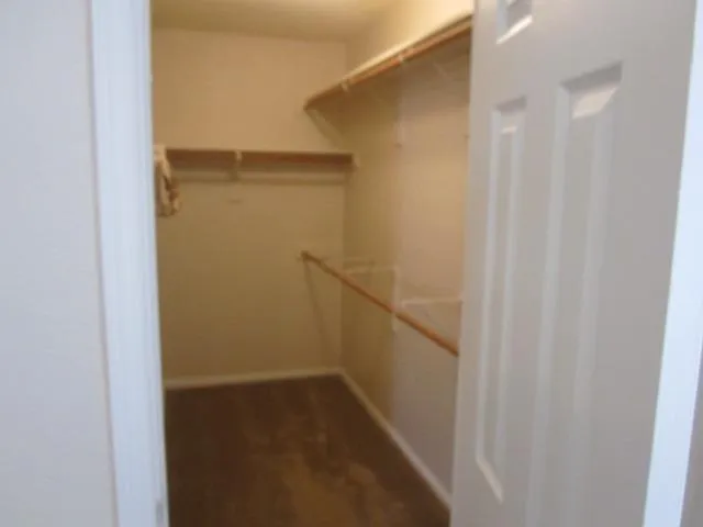 Very large walk-in closet in primary bedroom.