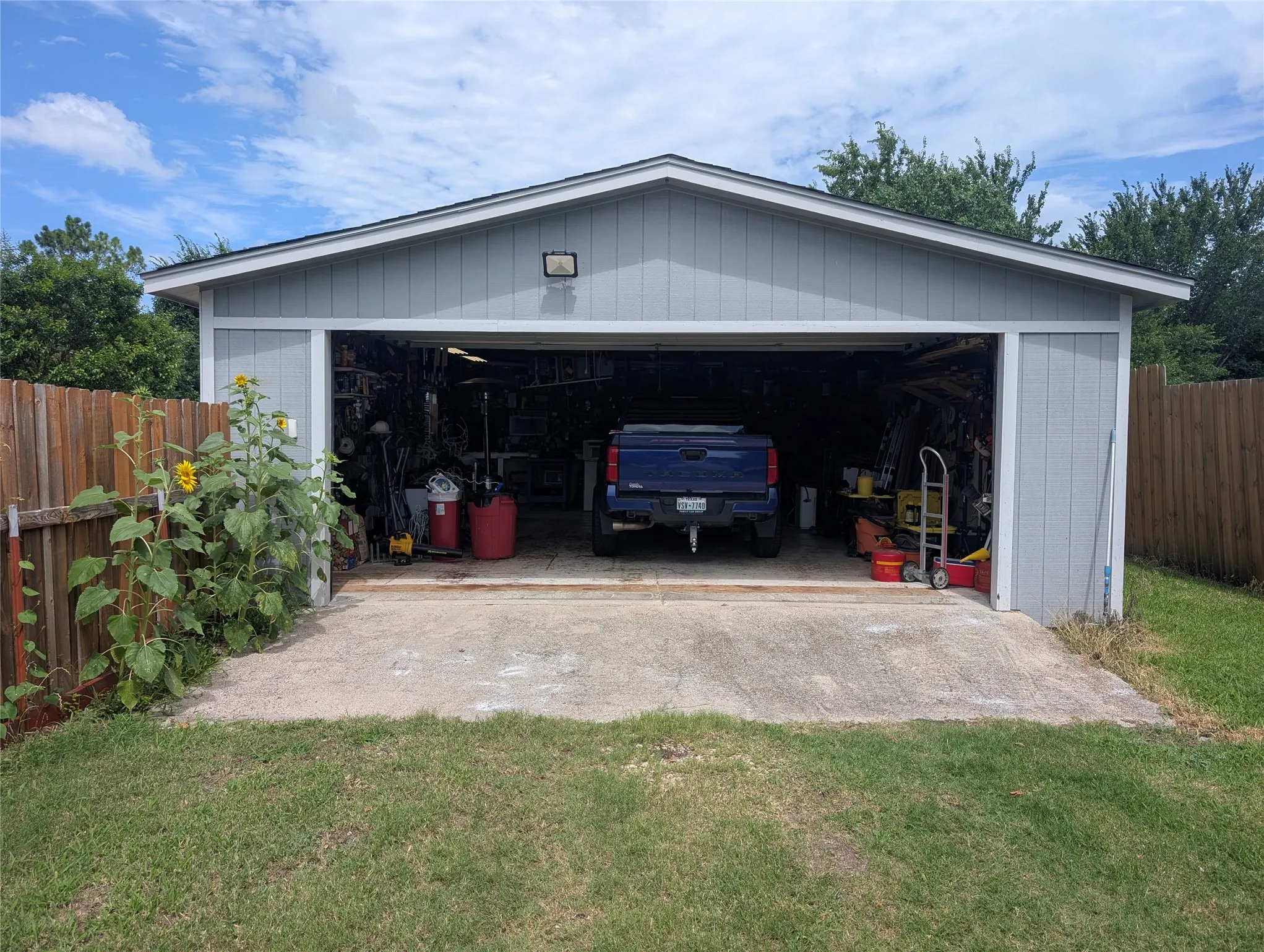 This is the ADDITIONAL detached garage.  The house has an attached two car garage.  This is your workshop or place for the jet ski, boat or sports car.