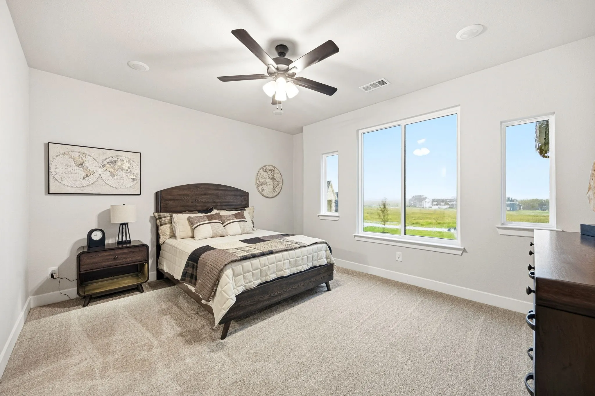 Bedroom featuring a ceiling fan with integrated lighting, recessed lighting, and light-toned carpeting
