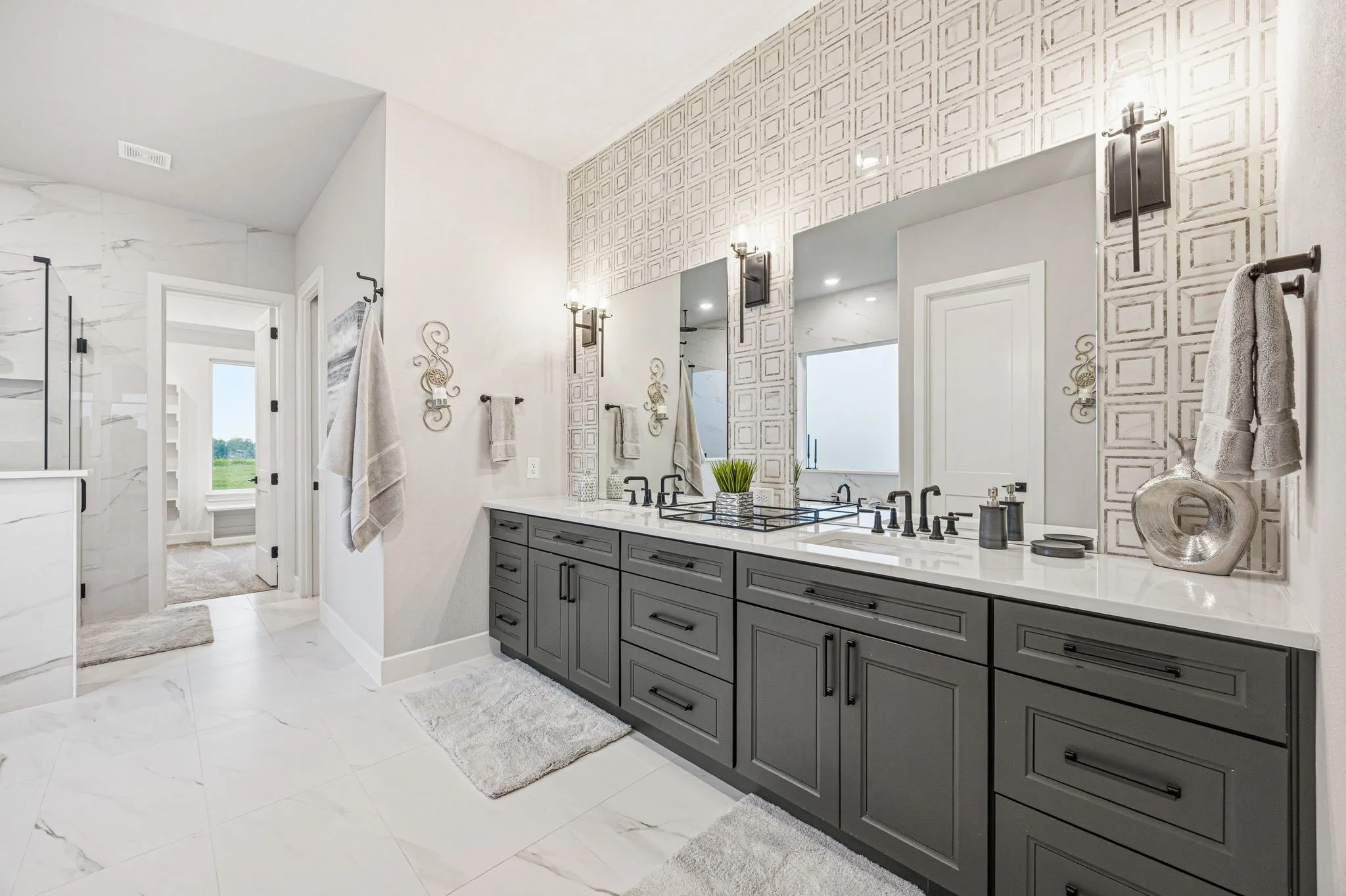 Dual vanity with gray cabinetry, white countertops, and matte black fixtures