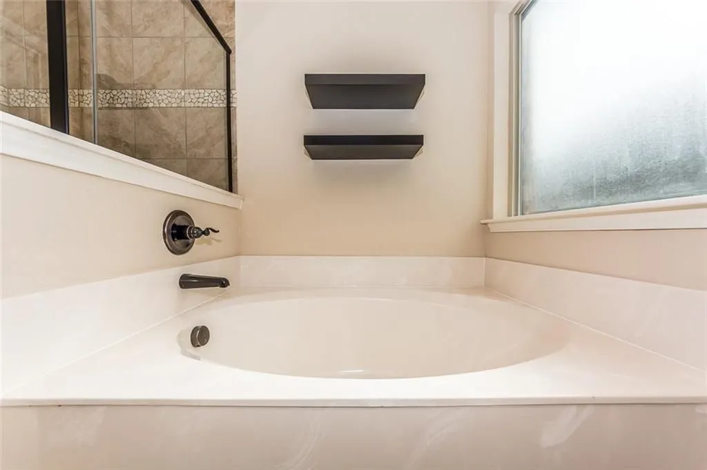 Featuring a large garden tub.