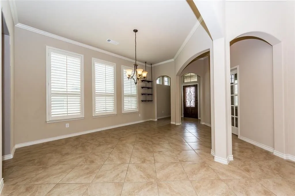 Dining room with lots of windows.