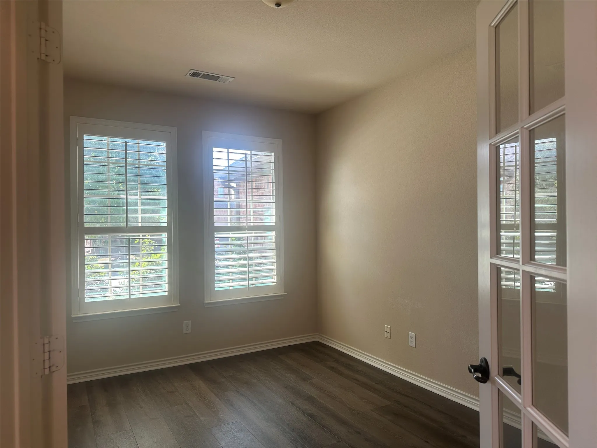 Ofice with french double doors at front of the house.