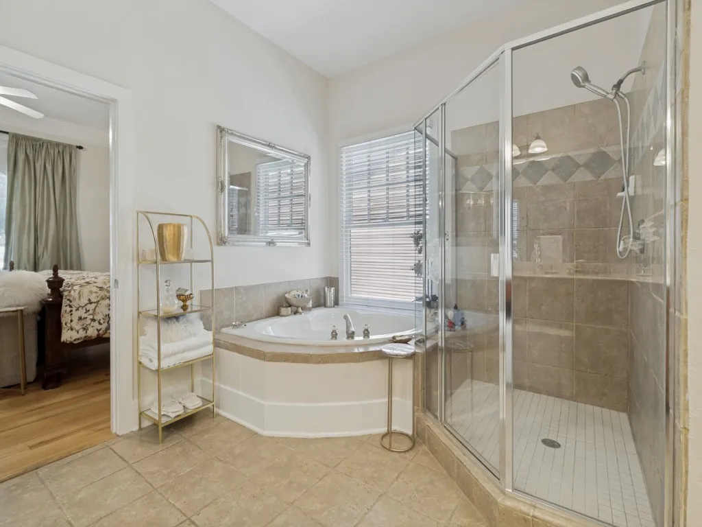 first level primary bath with separate shower & dual sinks