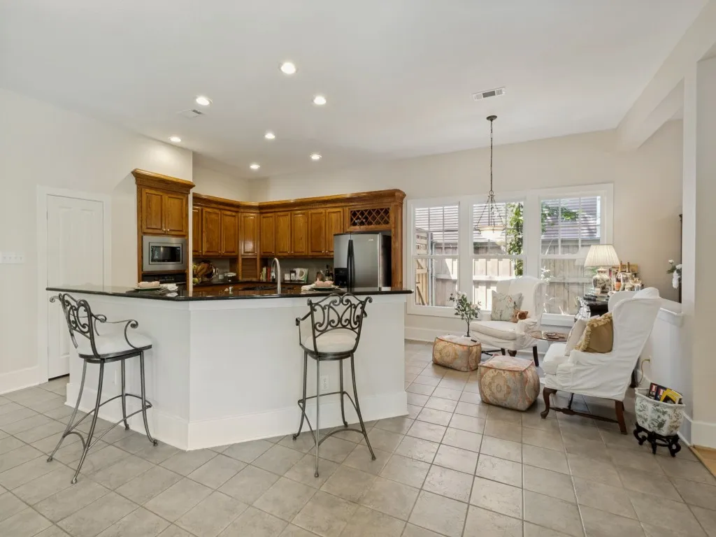 kitchen open and large and opens to the covered side porch