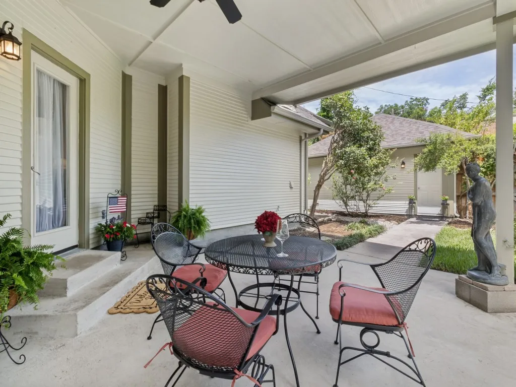 The covered patio overlooks the side yard.  perfect for bird-watching and gardening