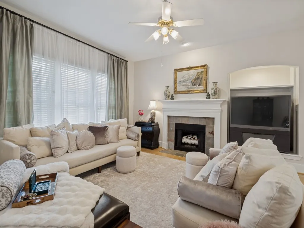 Liv area w wood floors and beautiful windows overlooking the back yard