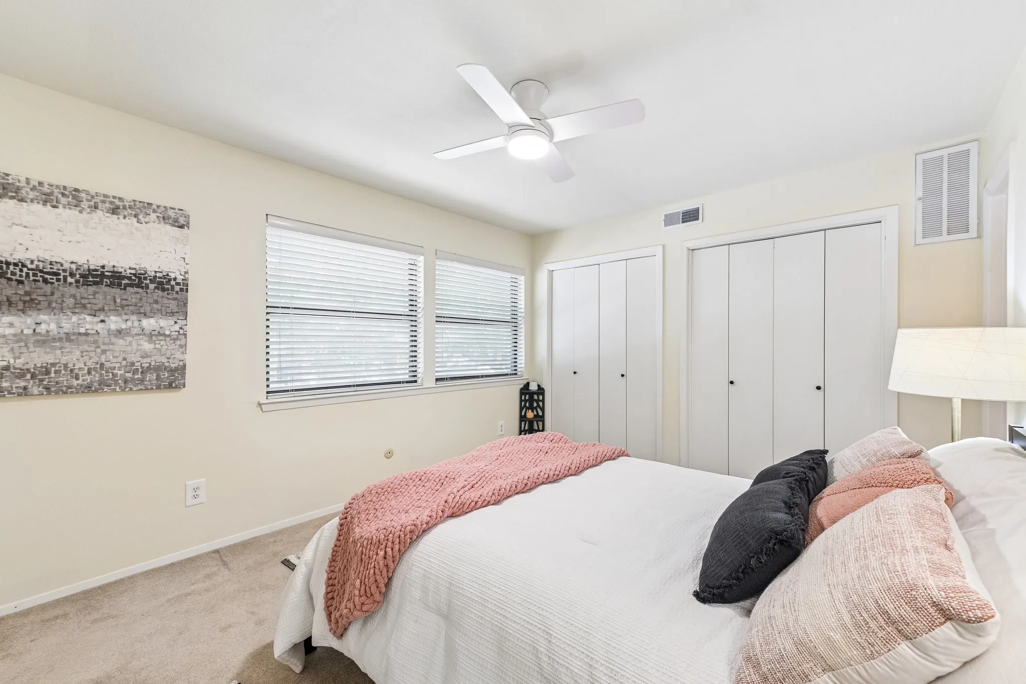 2nd bedroom upstairs with one walk in closet and two additional sliding door closets