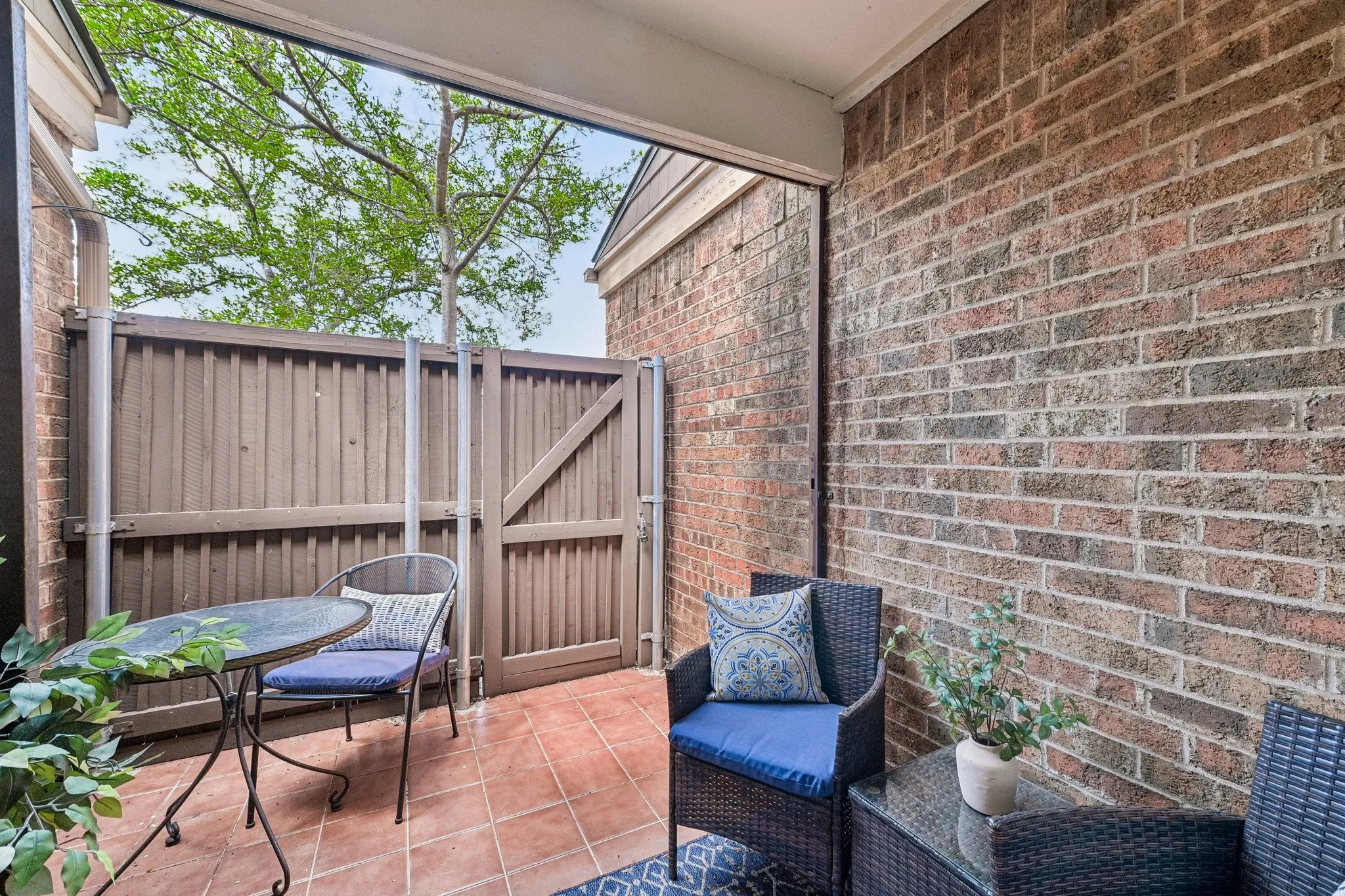 Private Patio leading to a reserved covered carport spot directly behind the home