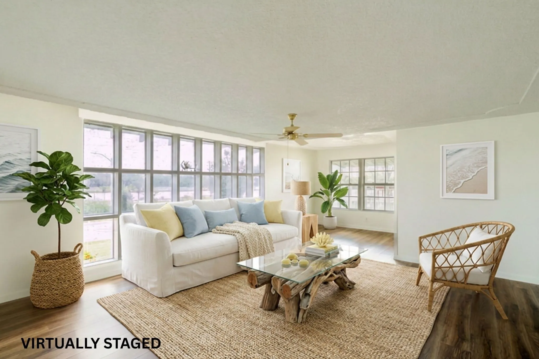 Living area featuring wood-finish flooring, a wall of multi-pane windows, and a ceiling fan