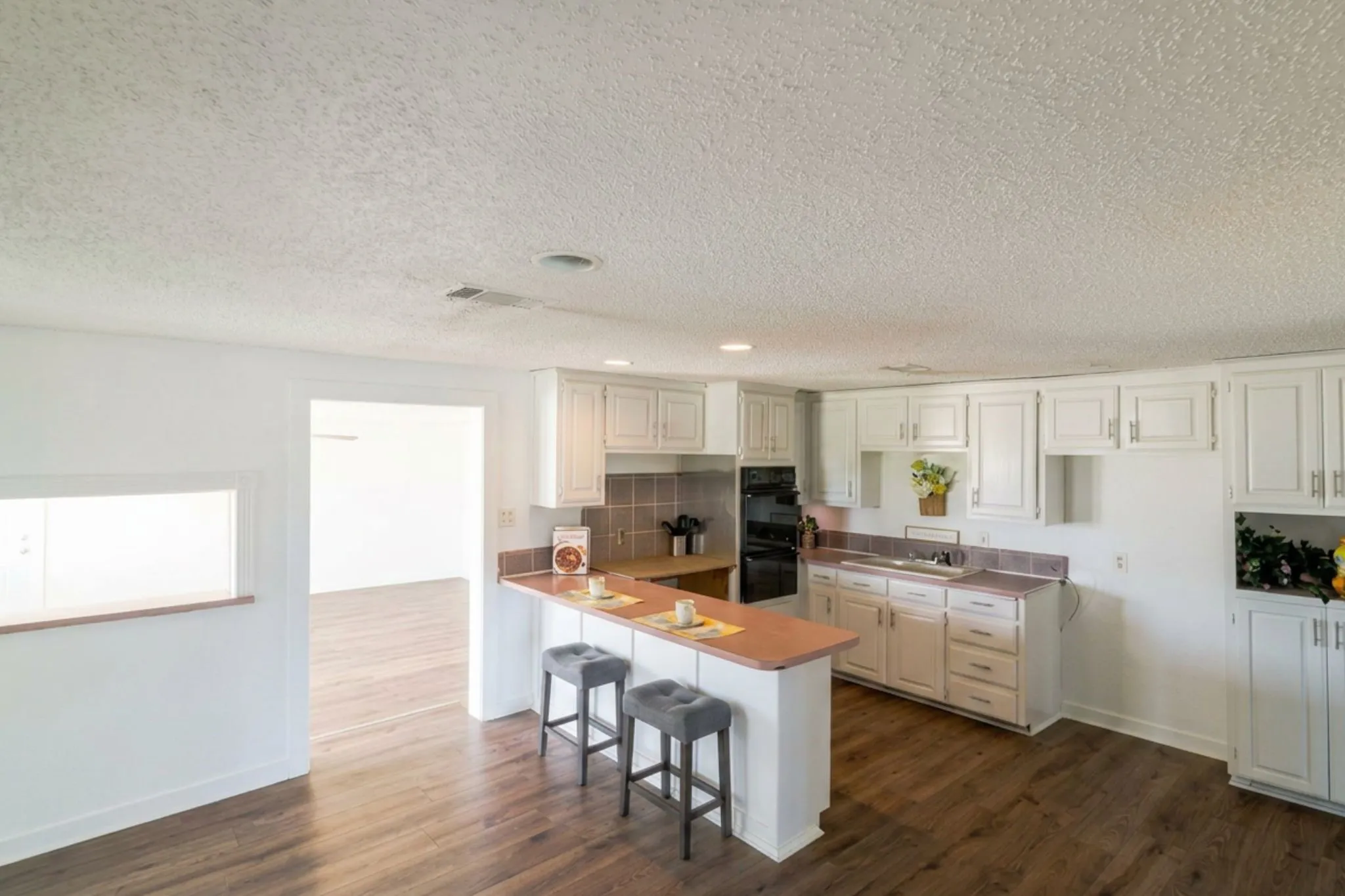Spacious kitchen needs work.