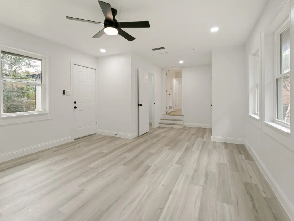 Primary bedroom suite - has door that shuts it off from other rooms if desired! Private access door to patio, back yard, private bathroom-shower