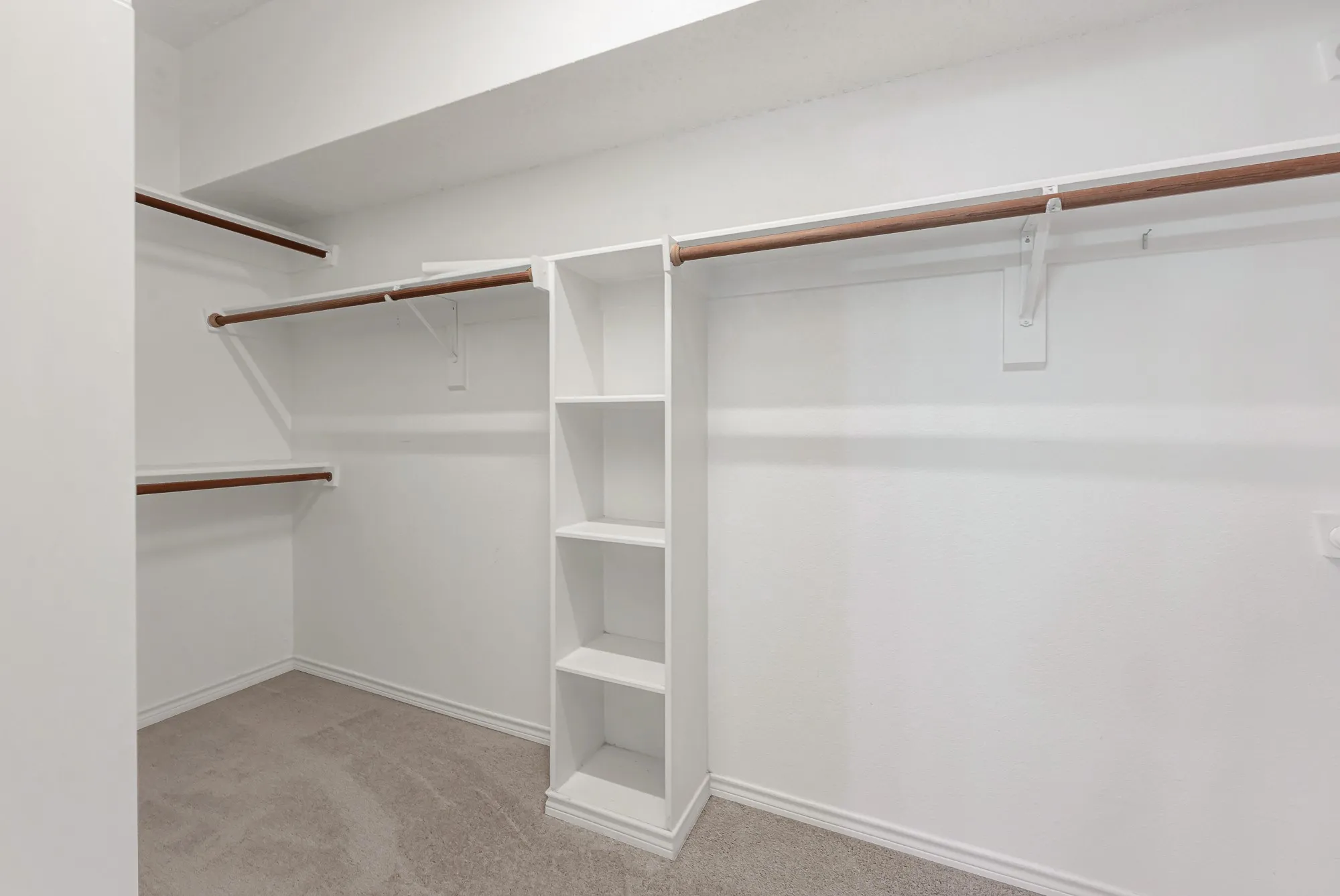 Primary walk in closet with fresh carpet just installed 6/16/2026.