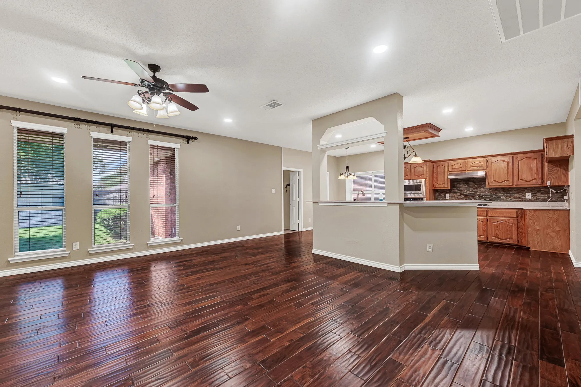 Family room open to the kitchen and view of backyard.
